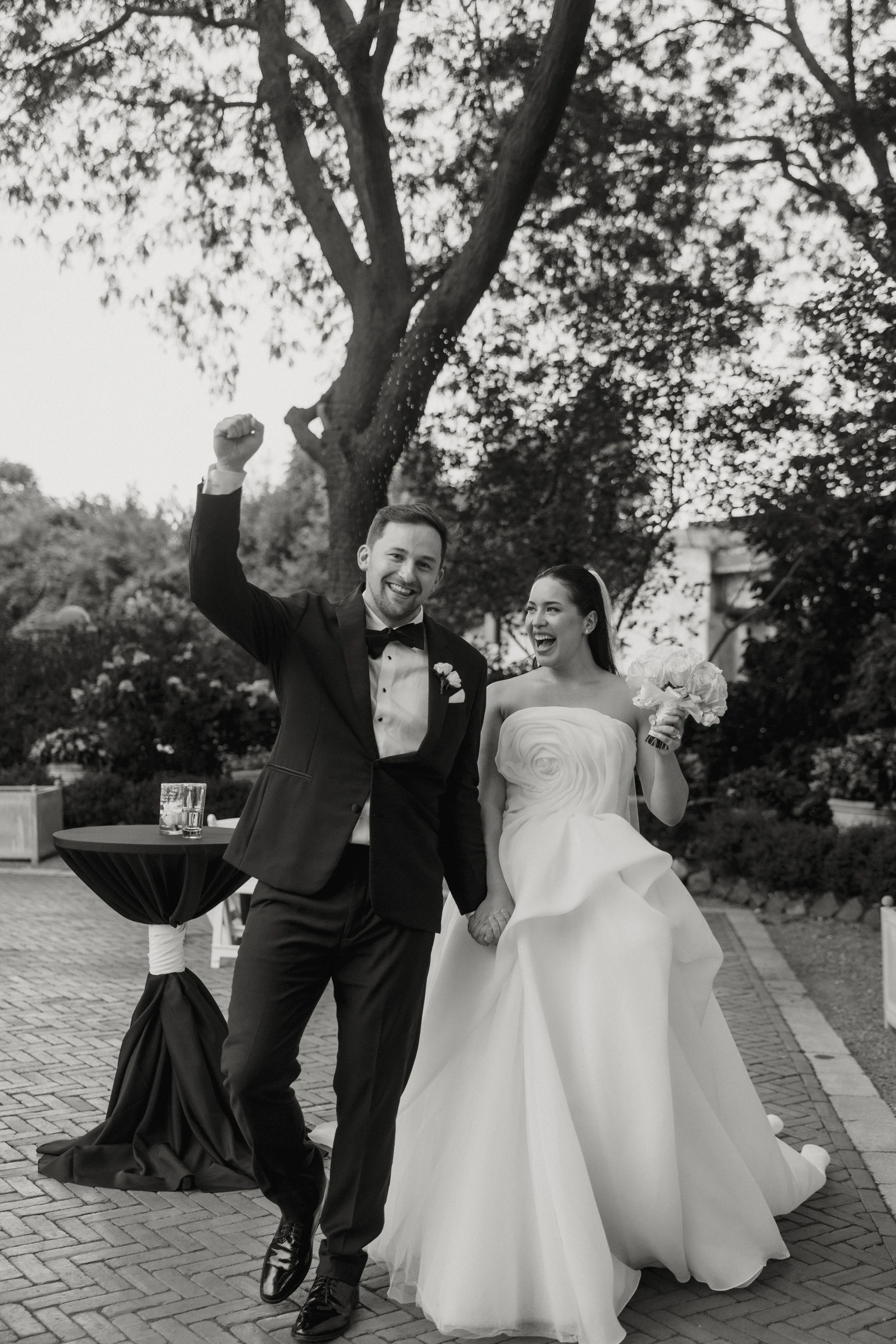 Bride and groom celebrating outdoors after ceremony captured by Chicago wedding photographer