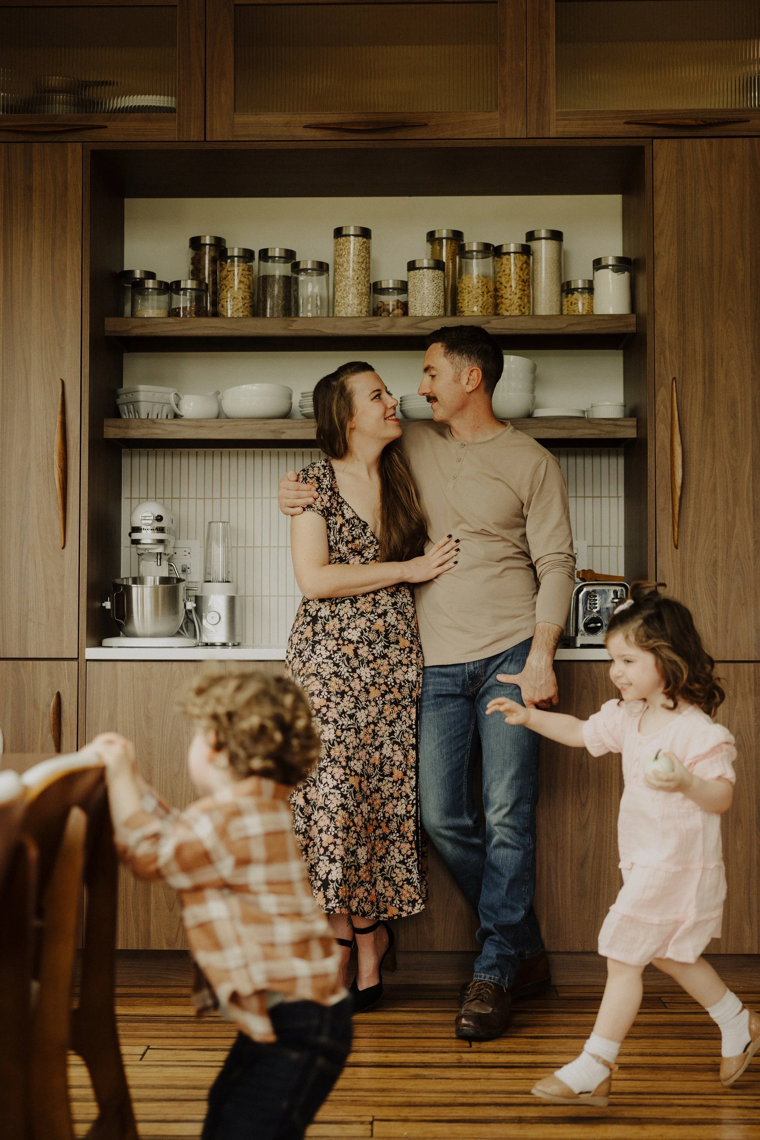 Family with two children playing in kitchen during lifestyle session by Chicago photographer