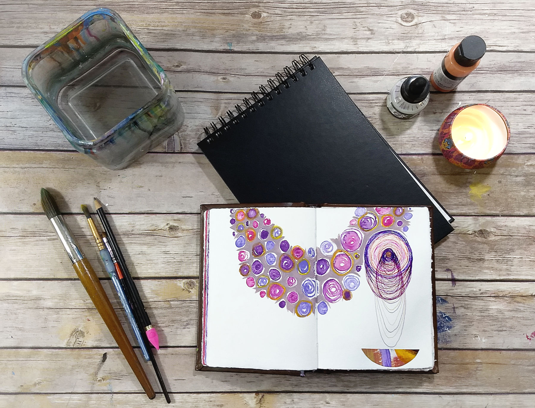 Join the Creative Practice Circle, live-online (image: Art table with art journal | Hali Karla Arts)