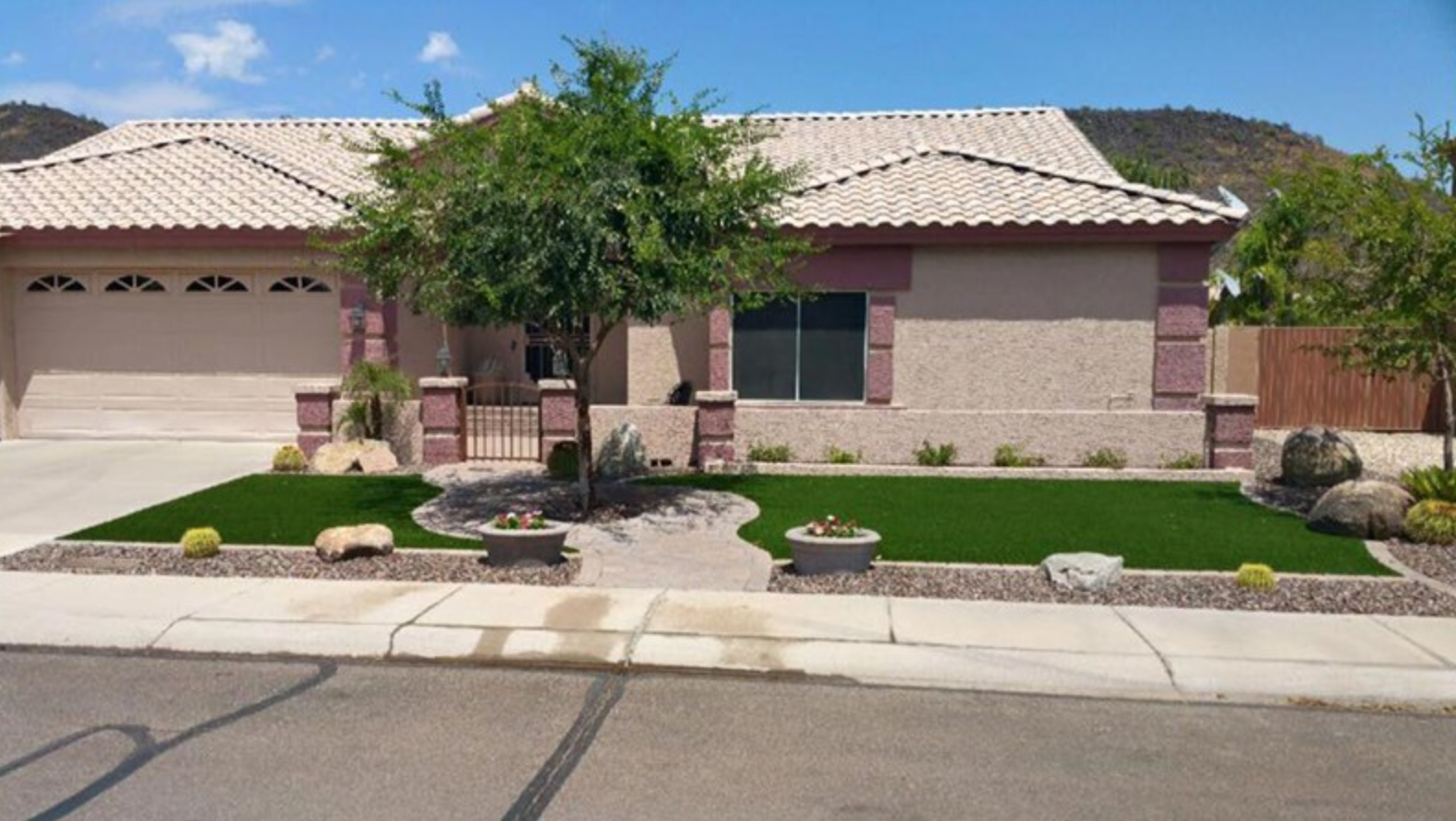  Artificial grass installation in front yard creating and inviting entry and enhanced curb appeal. 