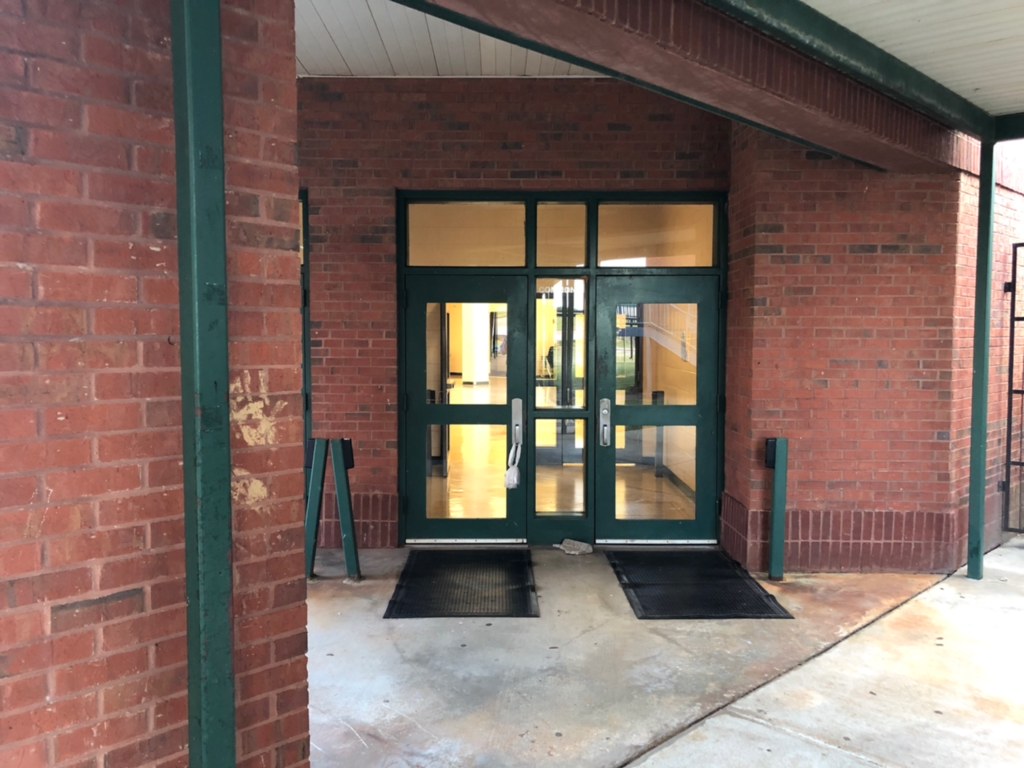 Warm Smiles at the Doors of Harris County High School