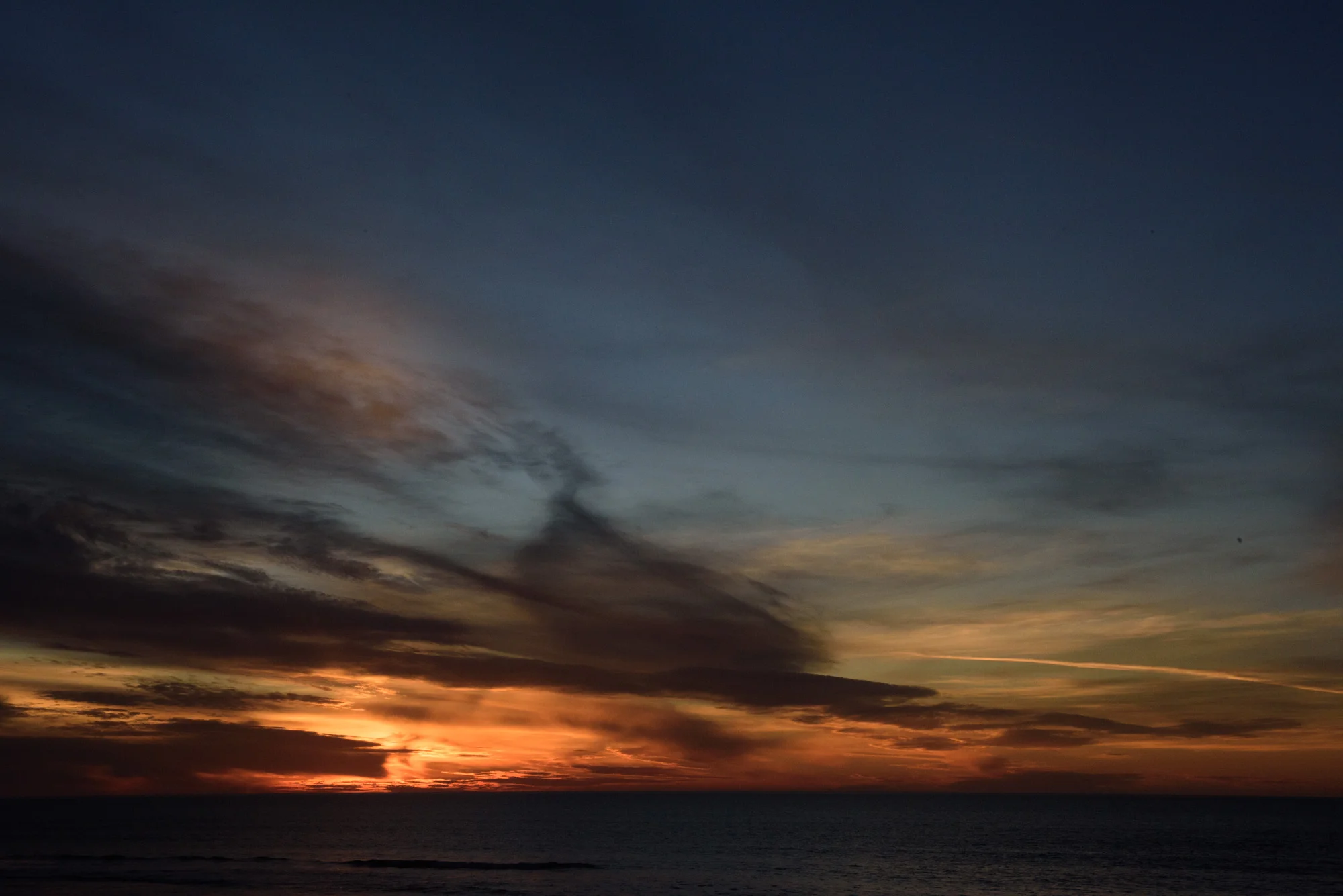 Watching the sun set over the Pacific Ocean