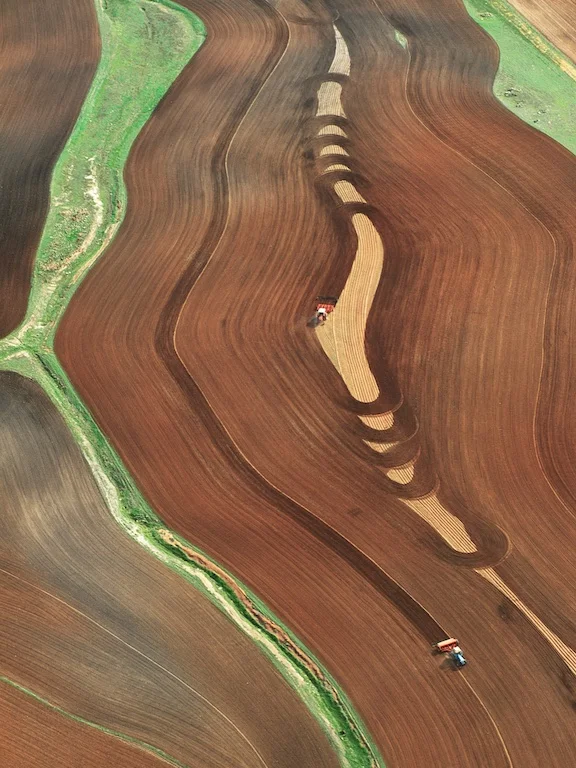 Tractor ploughing wheatfield, Northam, Western Australia, 1992.