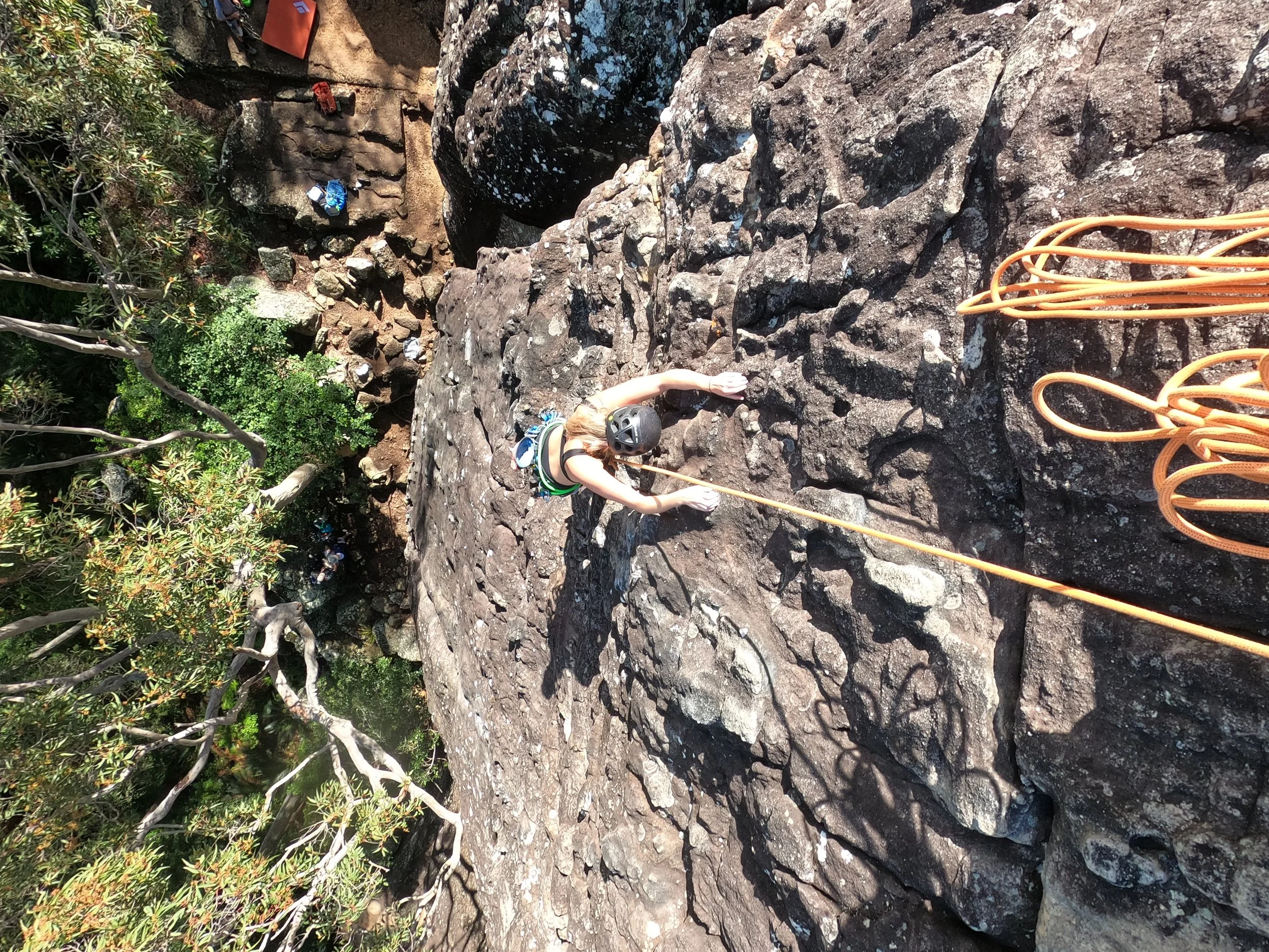 Outdoor climber on a multi-pitch rock climbing route guided by Big Nature Adventures in New South Wales