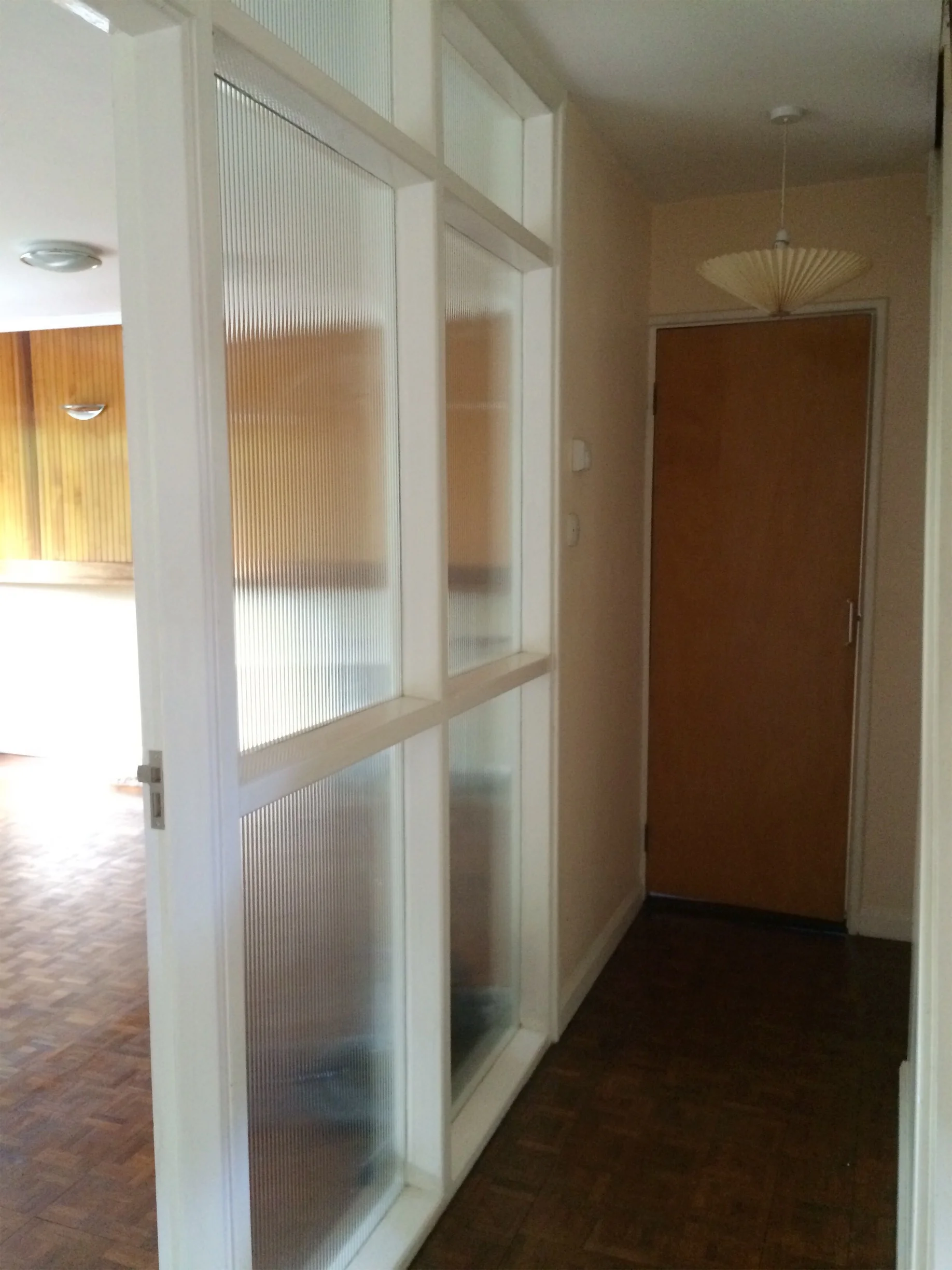 The wrap around corridor with classic sixties room divider