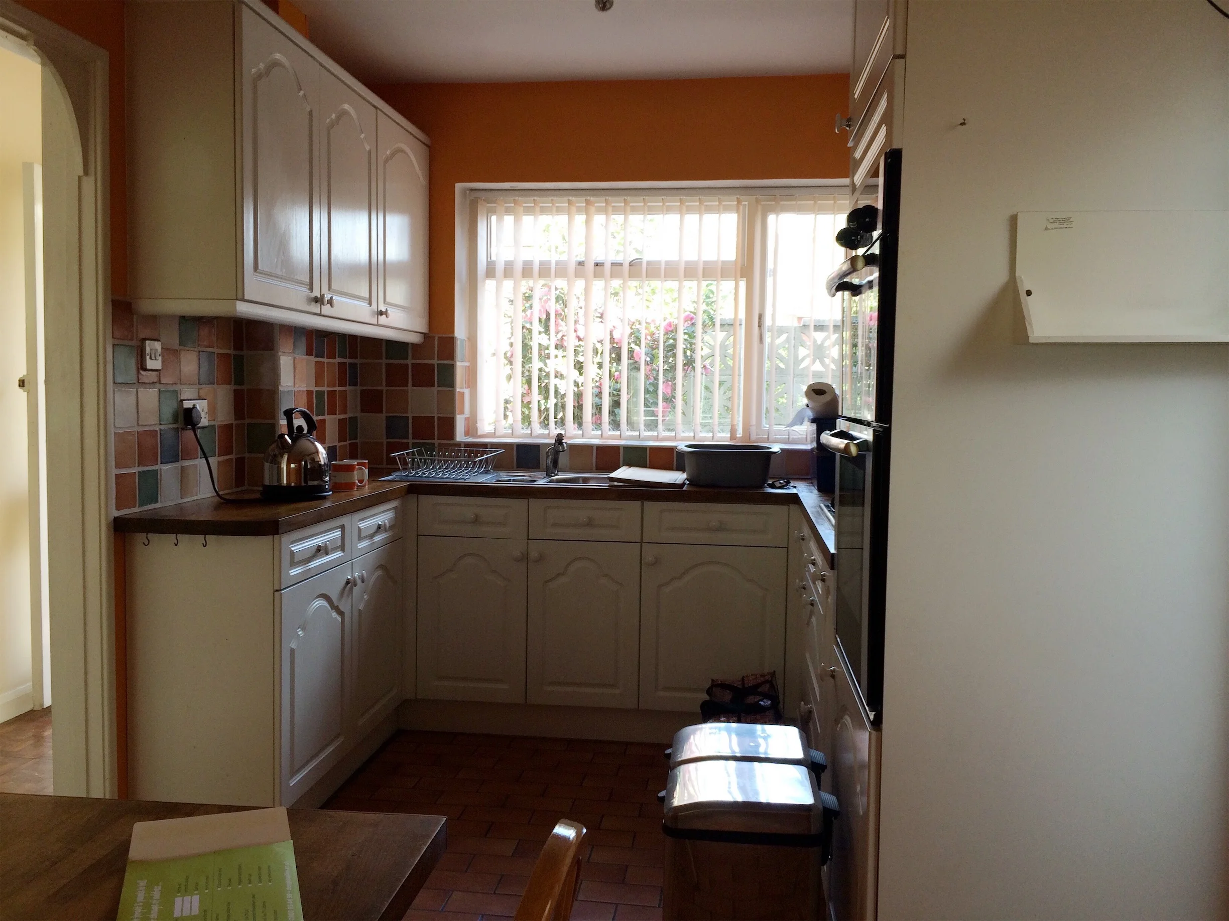The bright orange kitchen