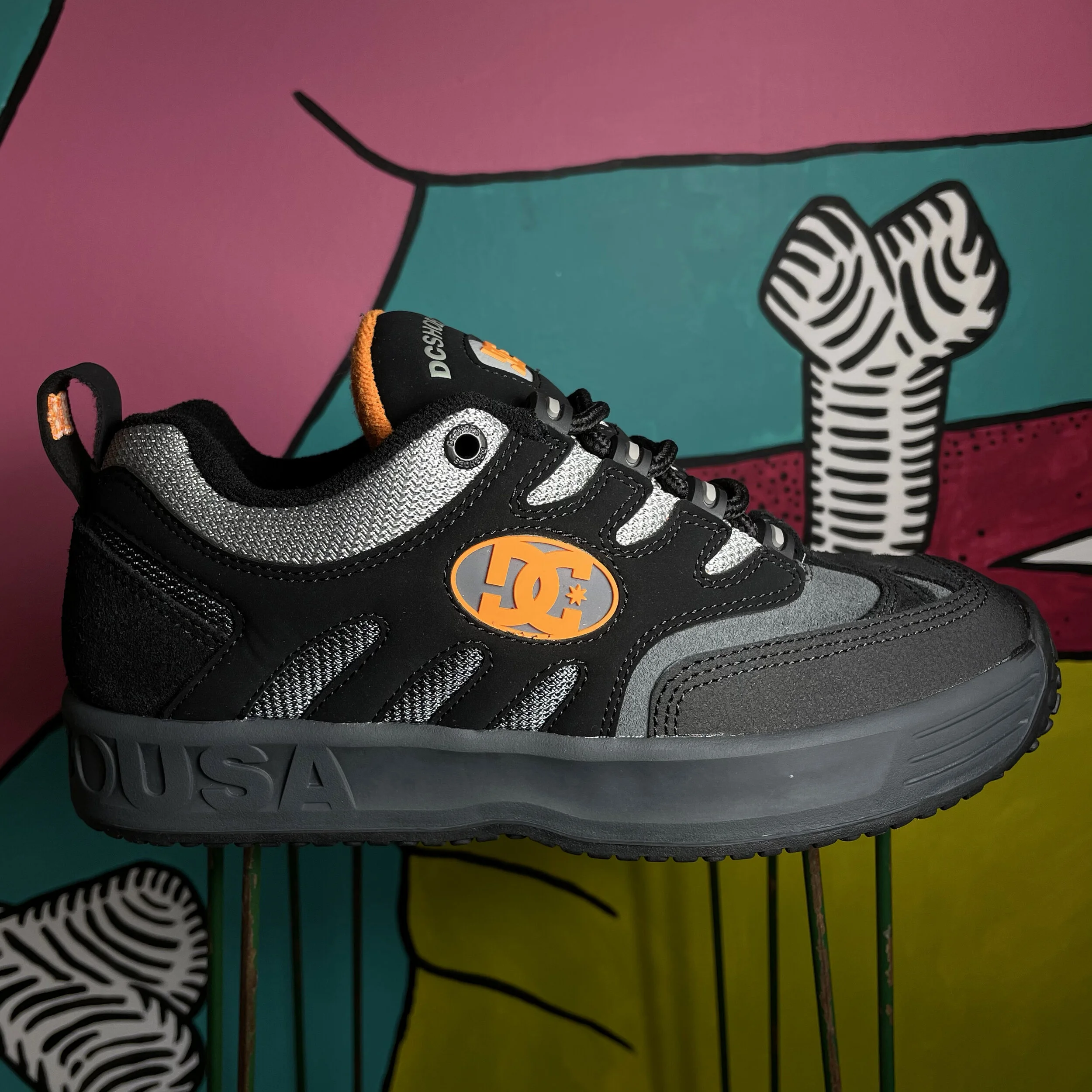 black and orange dc shoes