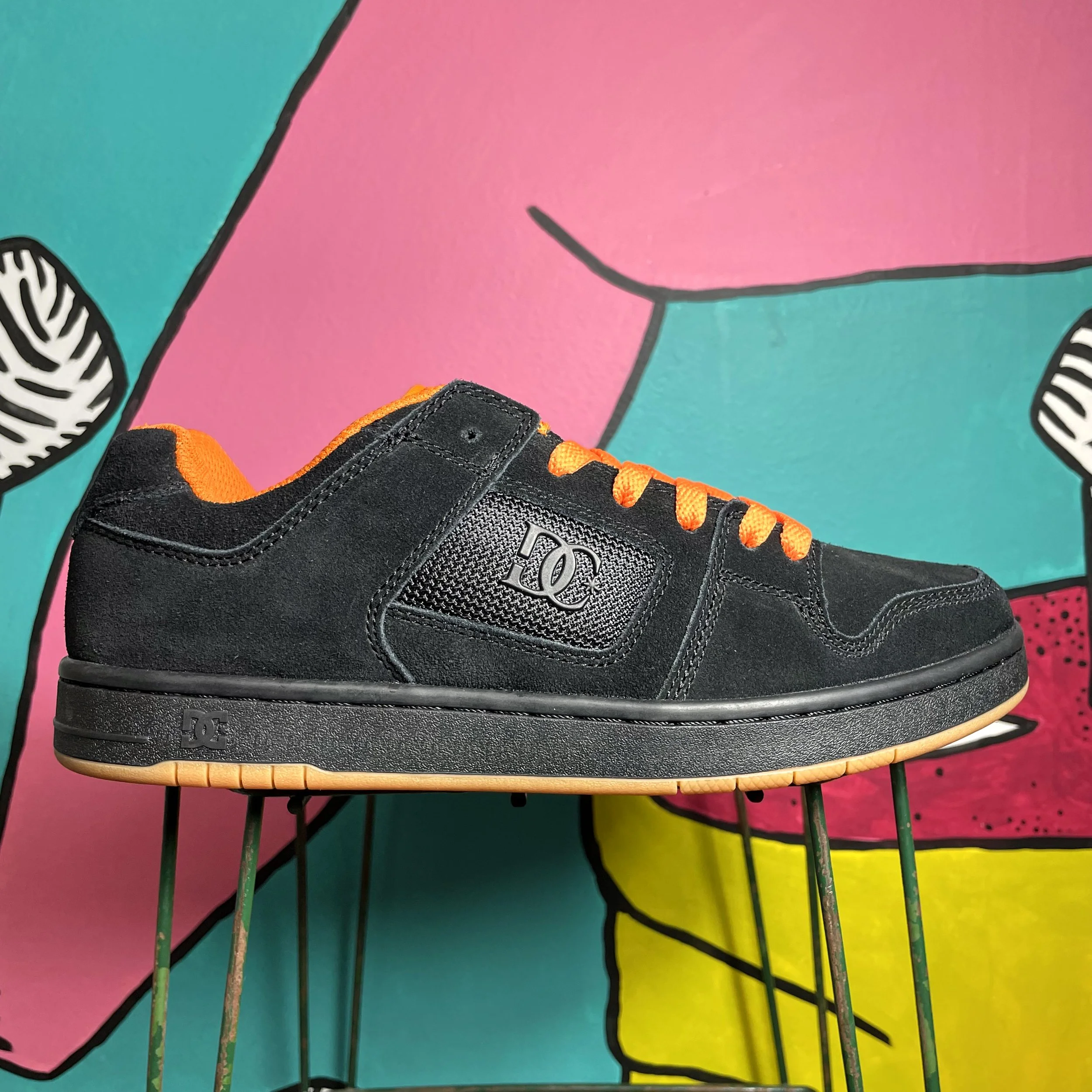 black and orange dc shoes