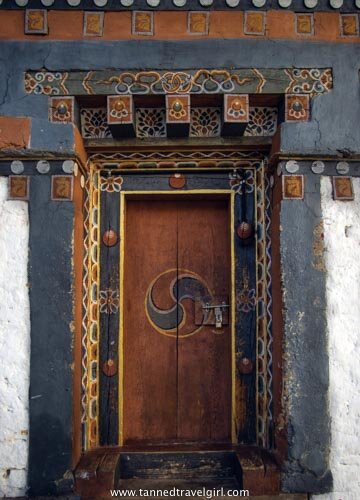 wooden and colourful door in trongsa dzong bhutan