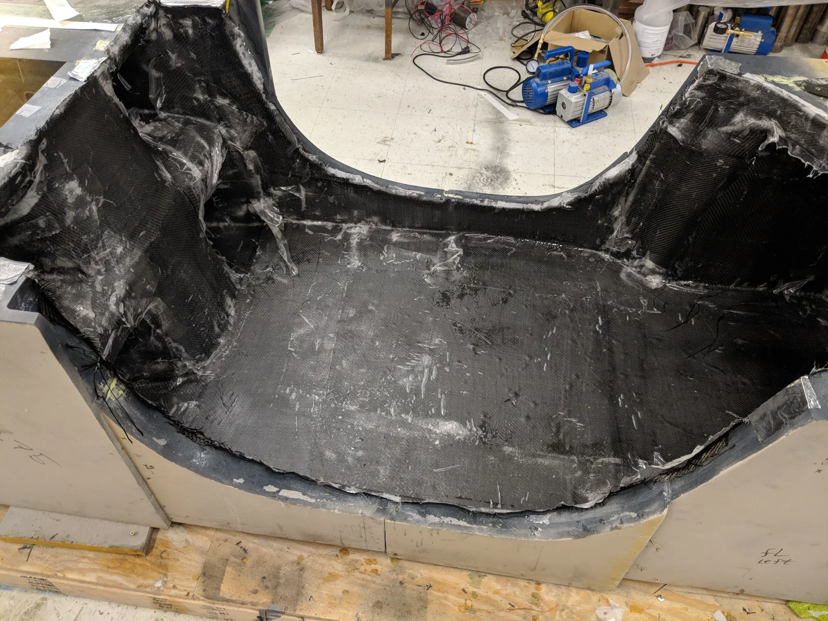 Chassis wet layup complete and curing.