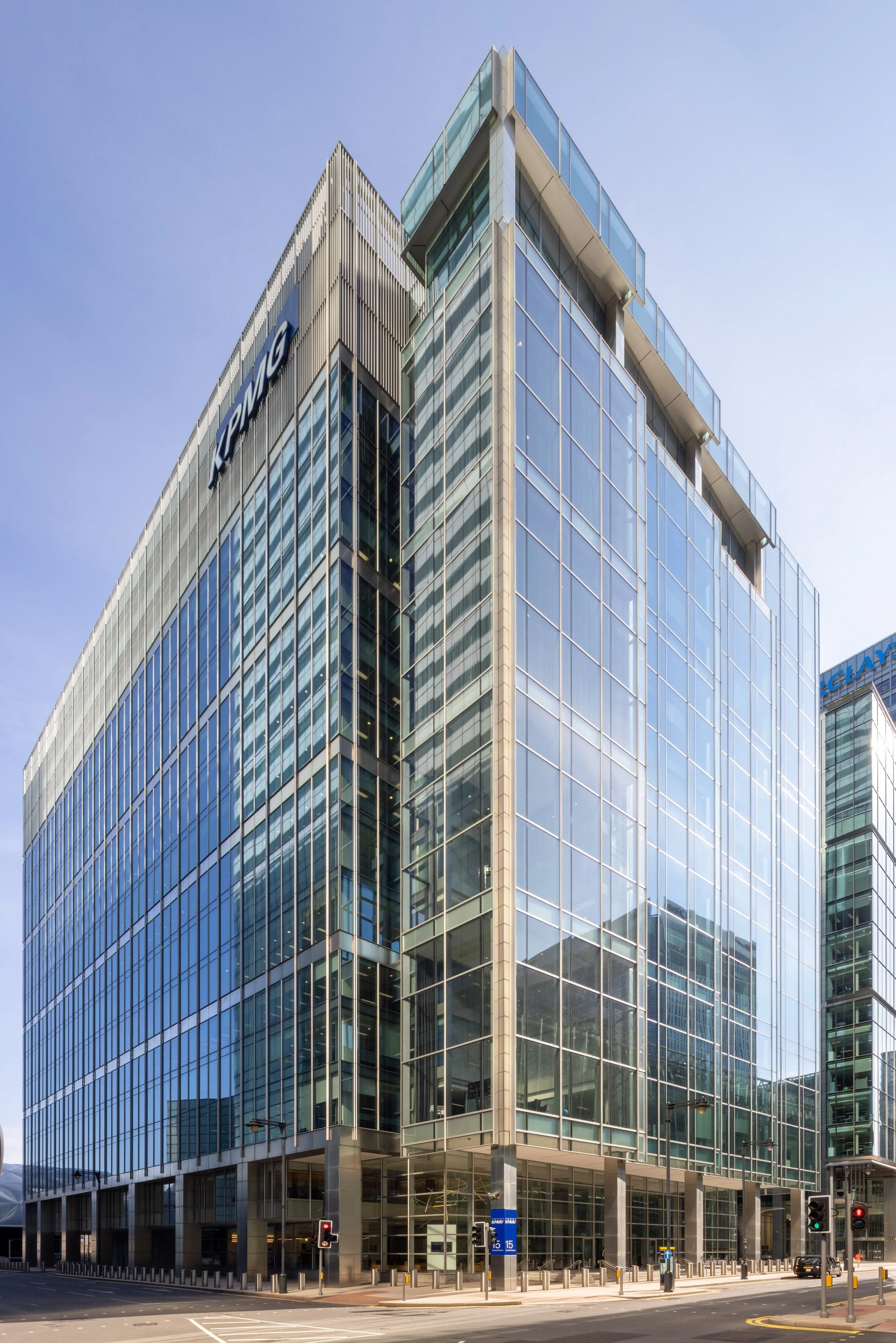 Modern glass office building with KPMG logo
