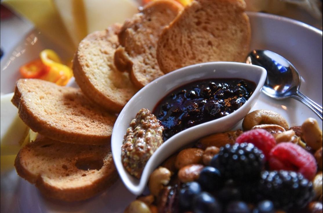 (Francisco Kjolseth | The Salt Lake Tribune) La Charcuterie with a daily selection of local cheeses, fresh fruit, Mediterranean olives, pickles, baby peppers, house nuts, gran mustard, huckleberry serrano jam and grilled baguette at the new London Belle Supper Club, a new Salt Lake City bar named after Belle London, a famous Utah madam, at 321 S. Main.