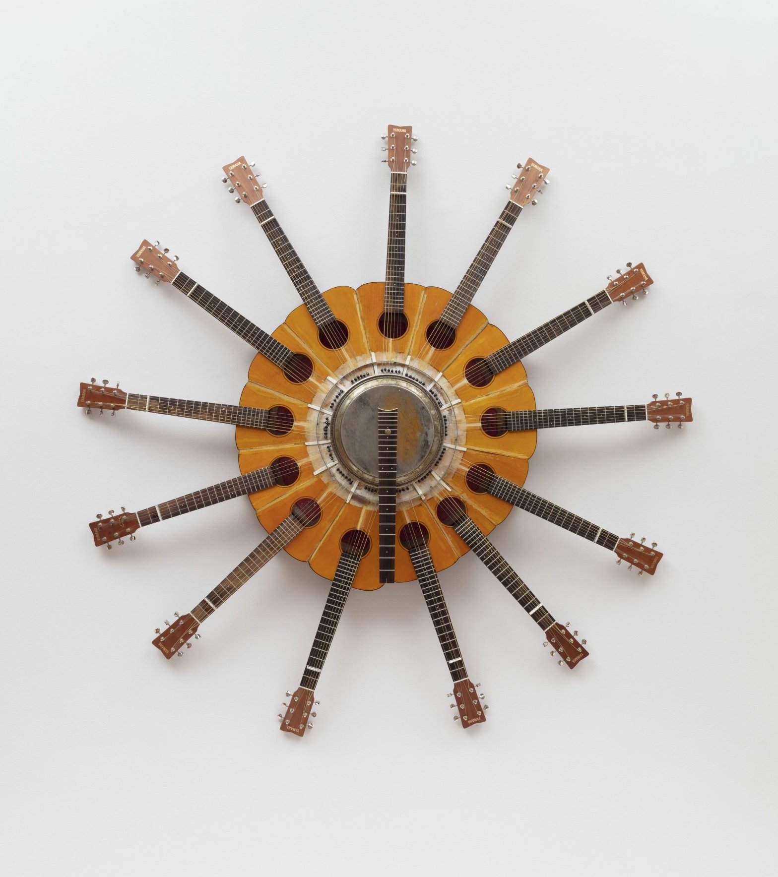 Hyperallergic: Willie Cole Recycles Musical Instruments Into Outstanding Sculptures