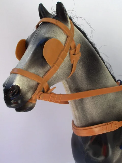 Dapple-Grey-head-in-gig-harness.jpg