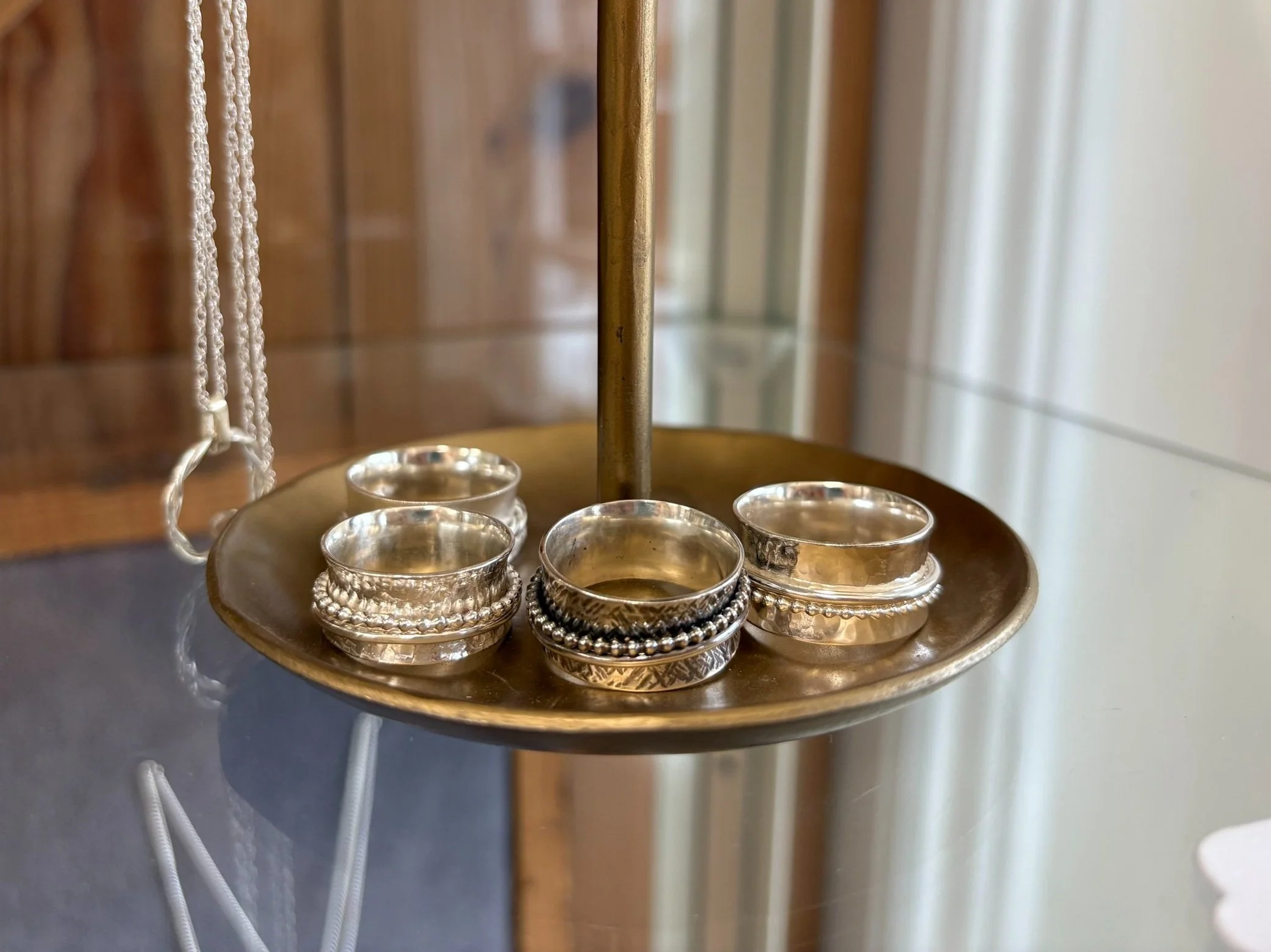 Sterling silver handmade spinner rings at jewellery workshop in Leicester.