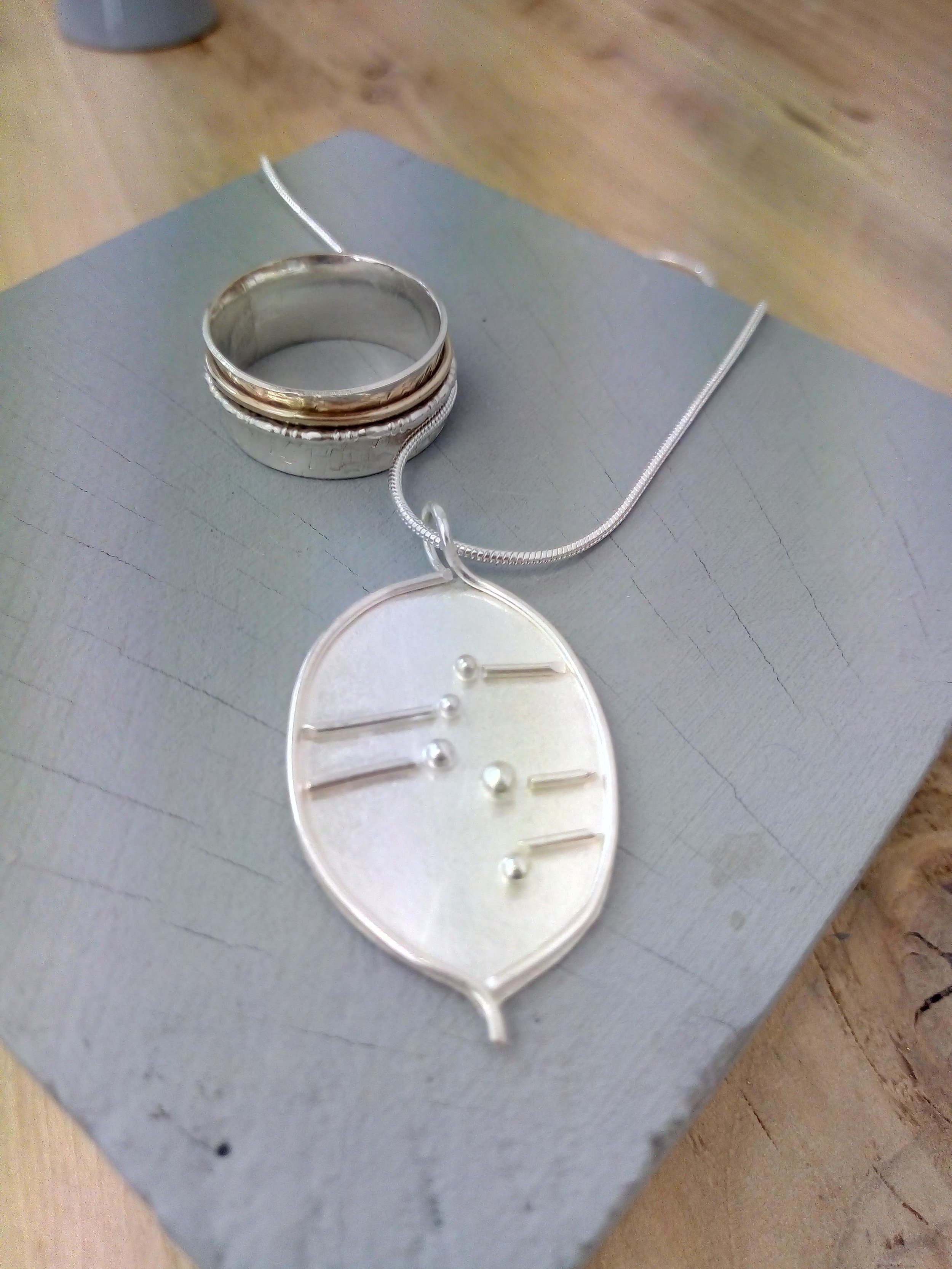 Sterling silver handmade pendant necklace and earrings.