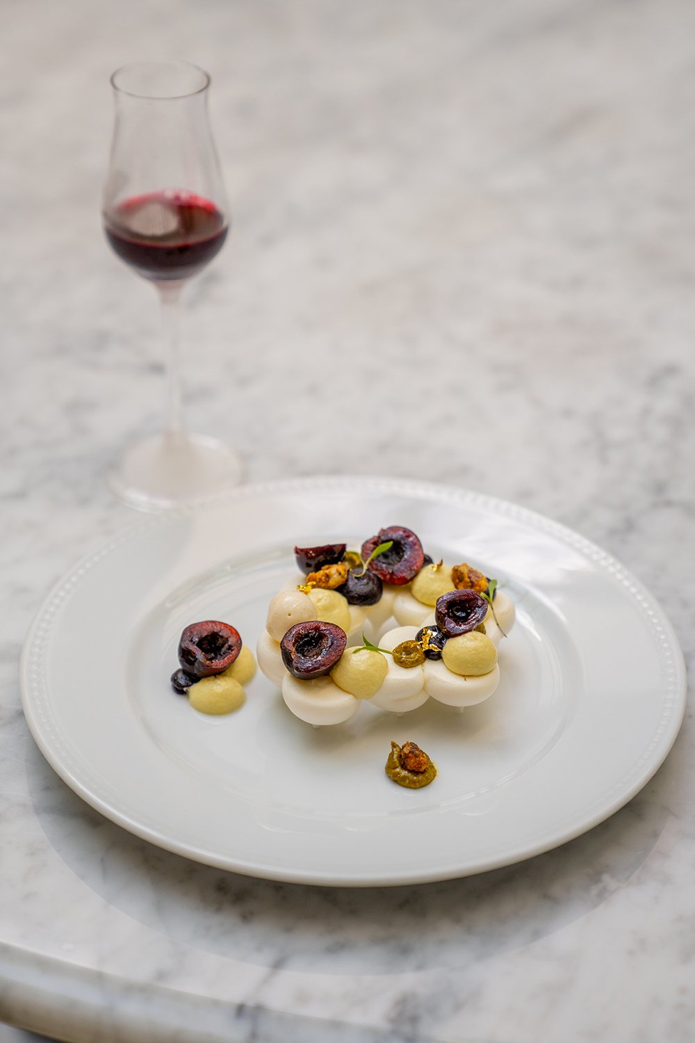 Pavlova cherry and pistachio praline cream with almond icecream.jpg