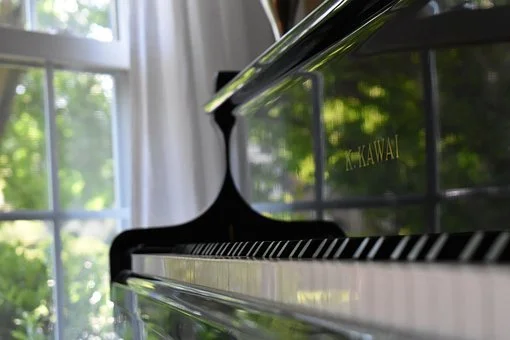 Piano-with-Window-Next-to-It.jpg