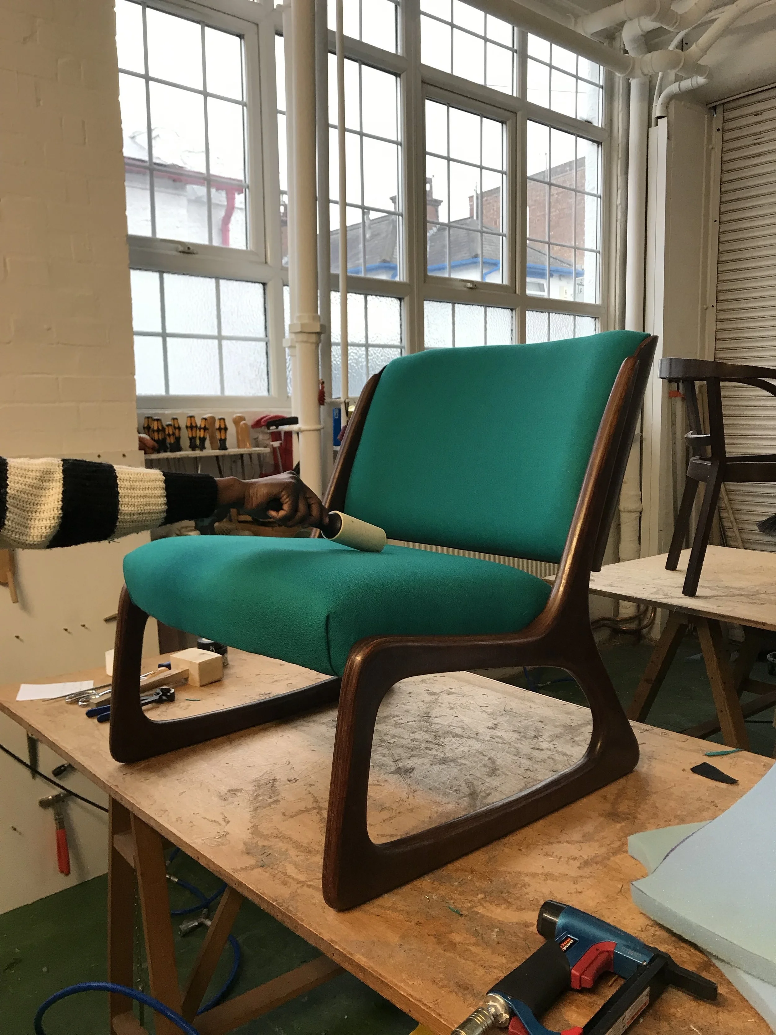 Gorgeous midcentury chair reupholstered in class at Edge Upholstery.