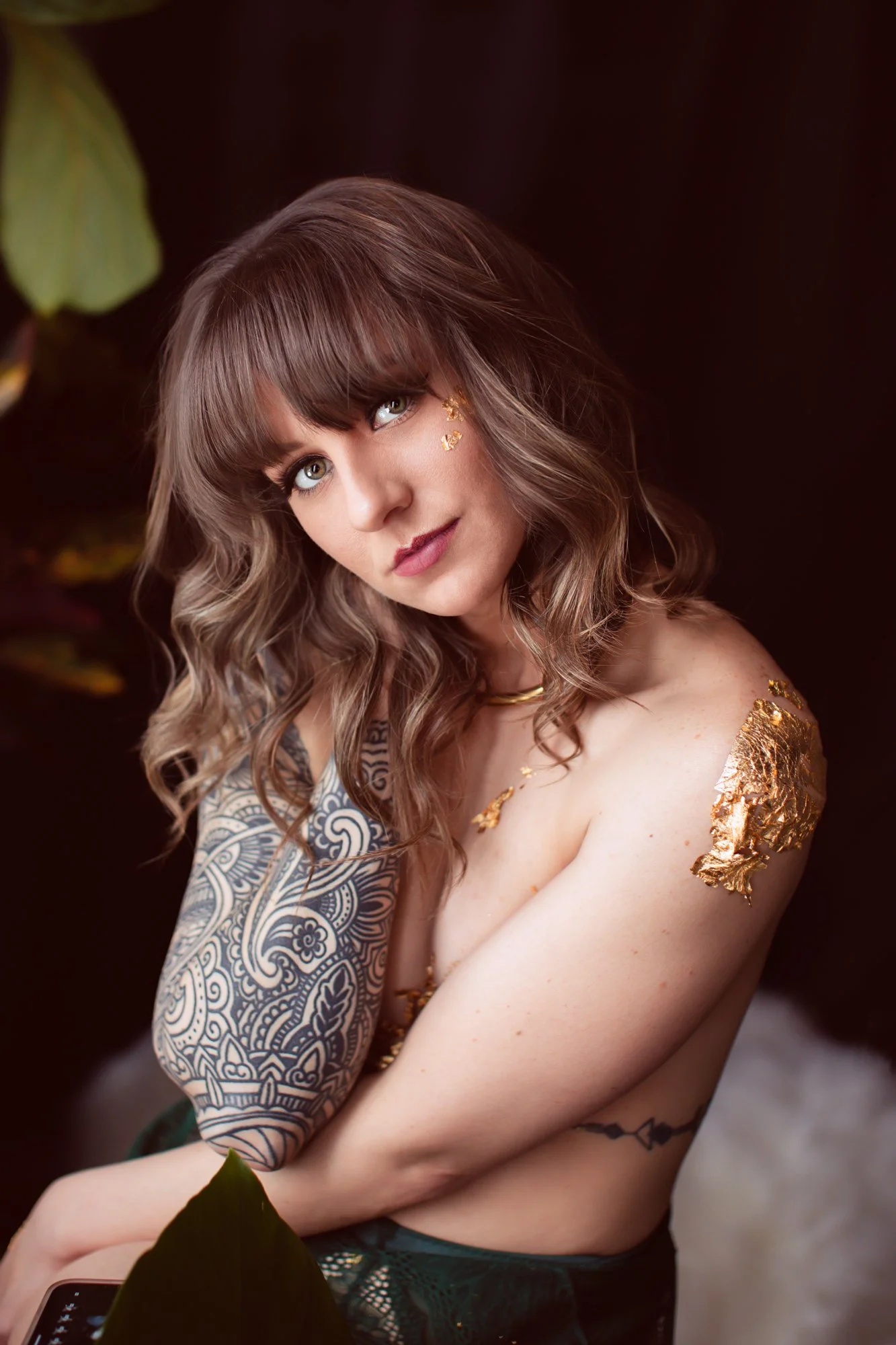 Women in green lingerie with gold foil