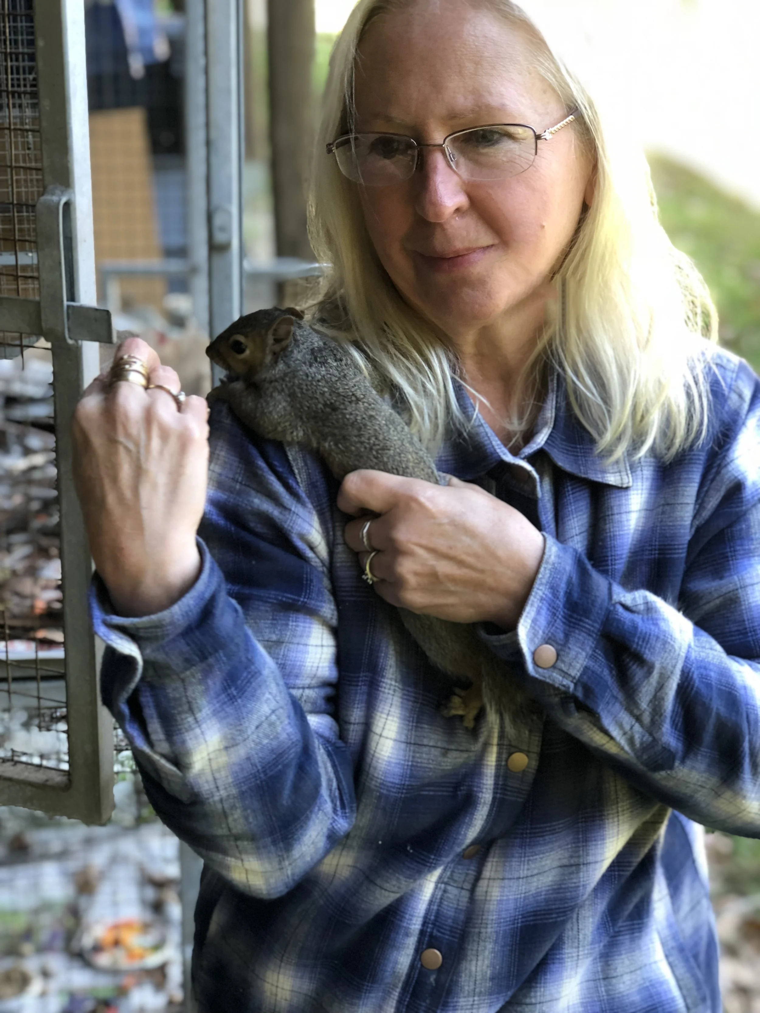 Melissa Morris and a habituated squirrel just learning to become wild again.