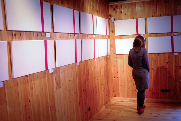 Artist Fríða Dís Gudmundsdóttir displays her work, "Próf/Tests" (translation: Exhibition/Tests) in Ljósanótt, Iceland. This exhibit depicts Fríða's journey through infertility. It took her and her husband 56 months and 56 negative pregnancy tests (i.e., one pink line) before becoming pregnant. http://www.visir.is/g/2017170909511