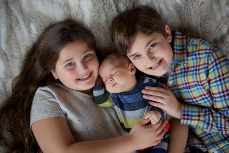 Three happy siblings