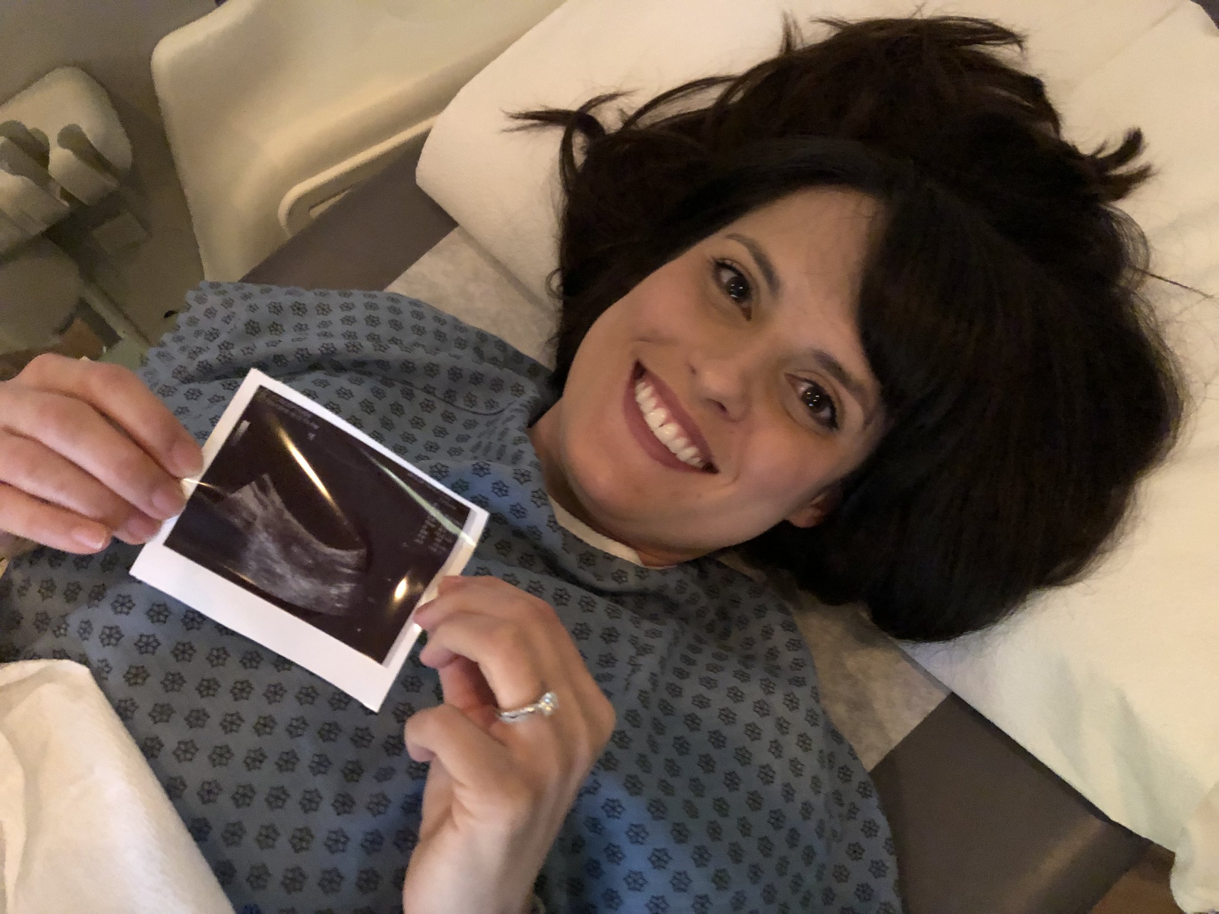 Kristen holding embryo picture.JPEG