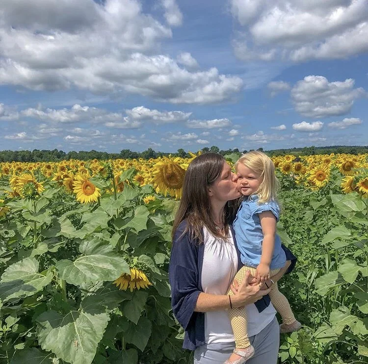 Mary Kate and daughter sunflowers.jpg