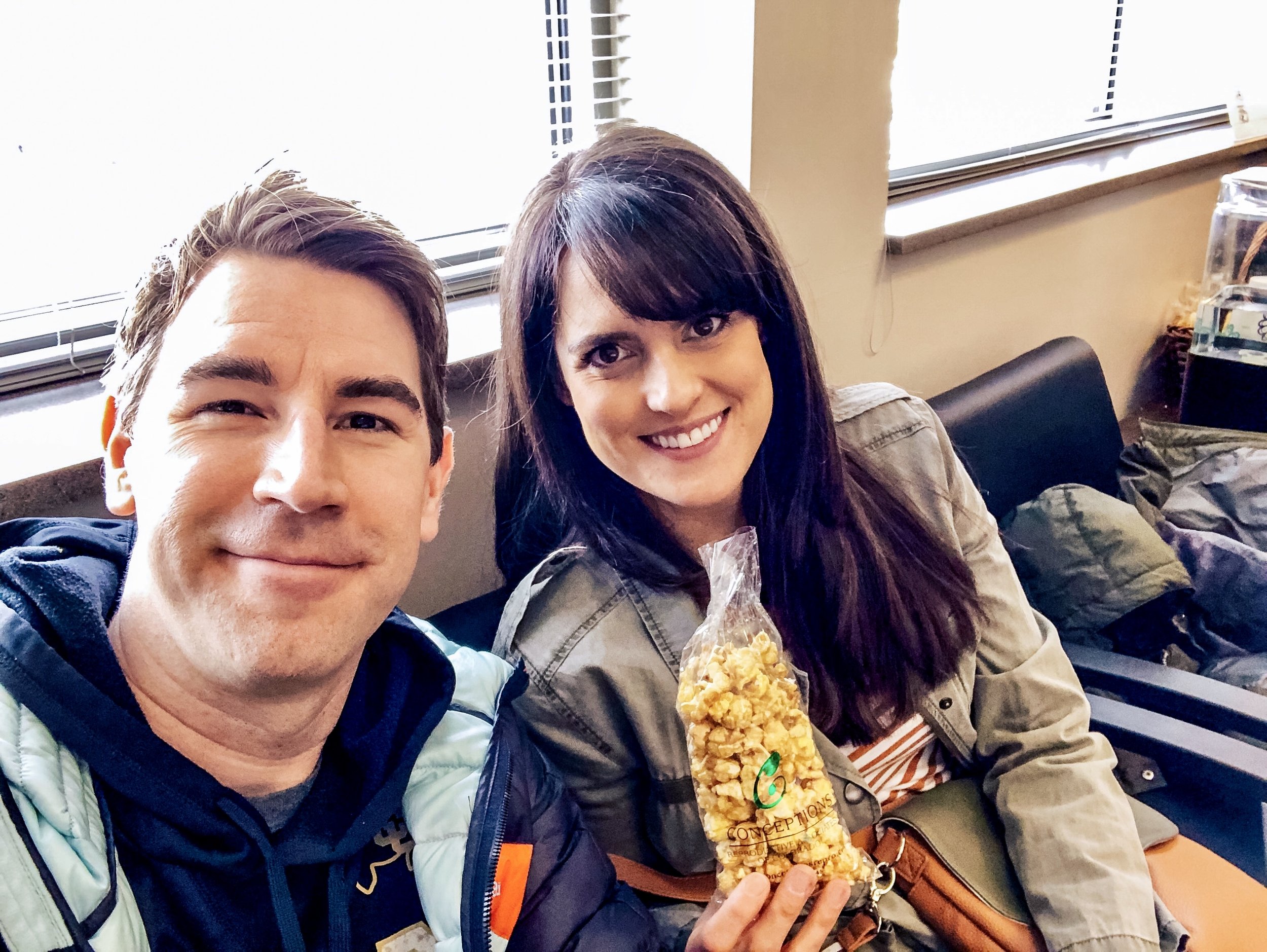 Cory and I sit in the waiting room at their Conceptions and have some of their signature caramel corn in honor of the burnt popcorn debacle that almost resulted in us cancelling this appointment.