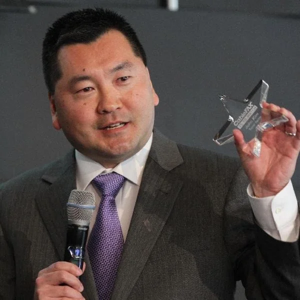 John Kim of US Kids Golf at a recent award ceremony.