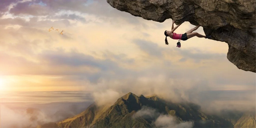 woman-free-climber-climbs-overhang-high-above-mountains-at-dawn-picture-id1090854882-2.jpg