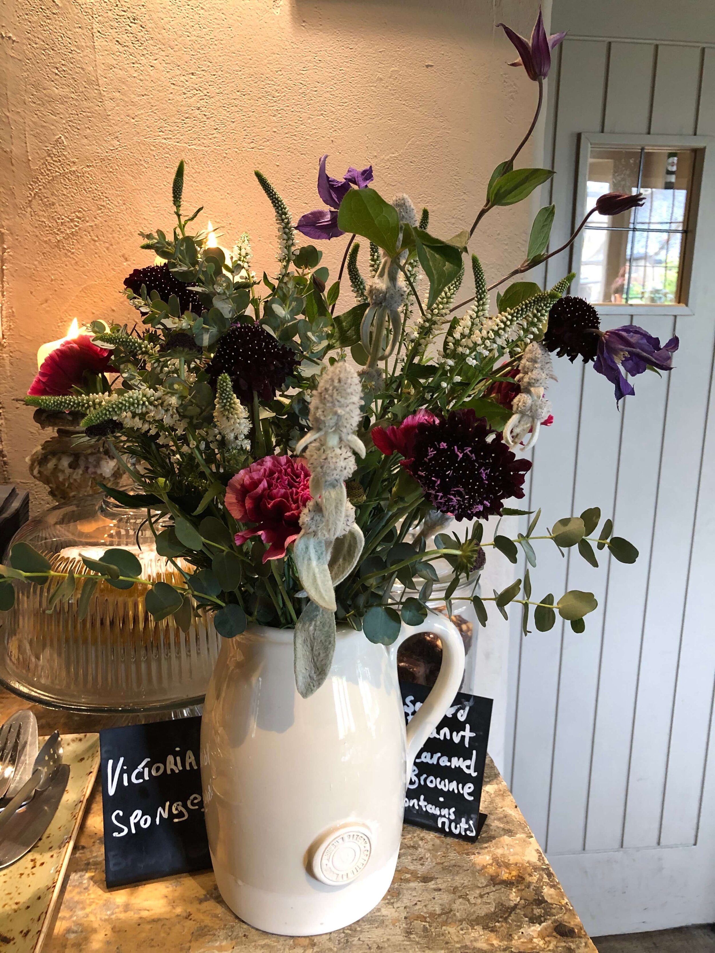 flower bouquet in jug at cafe