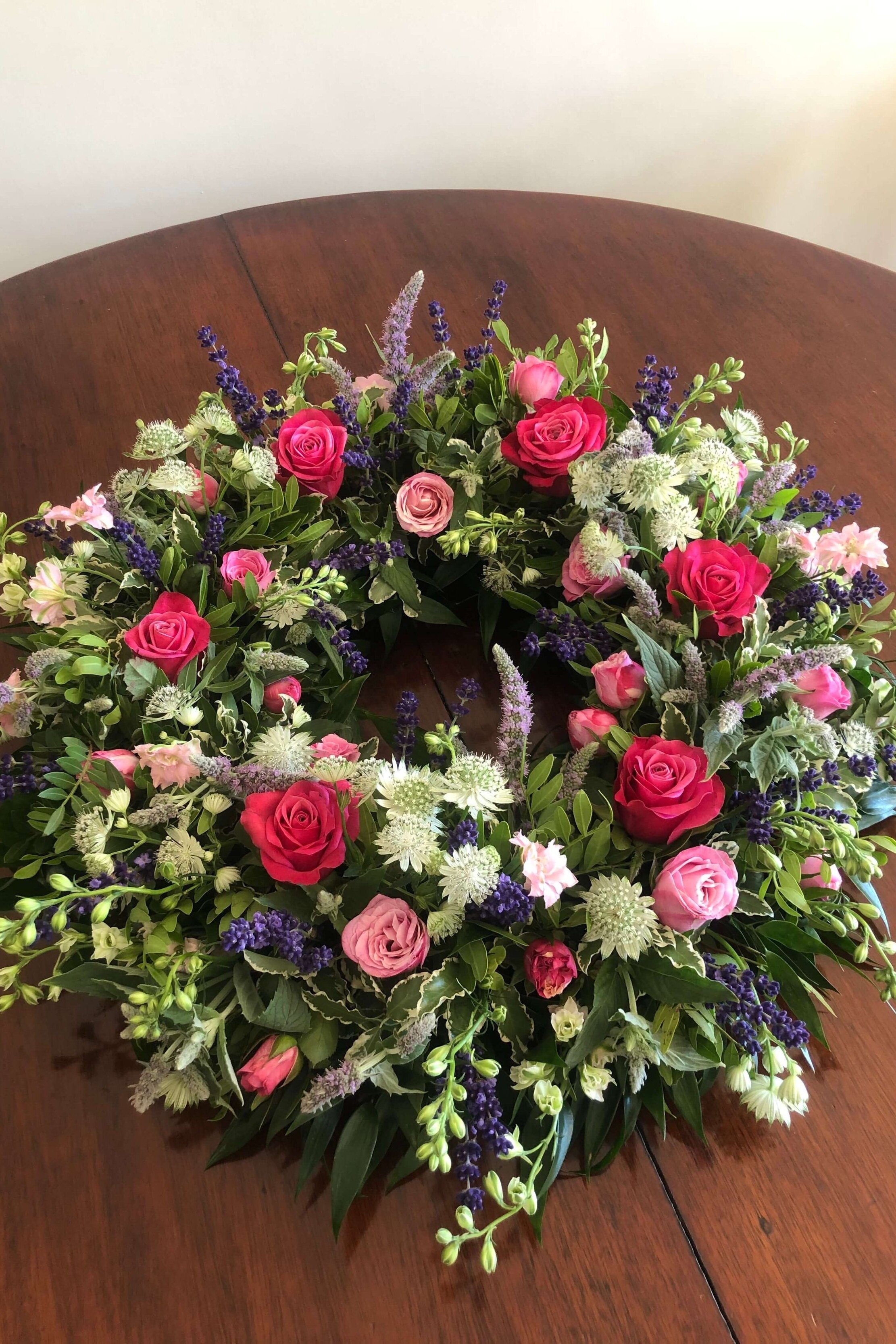 red and pink funeral wreath