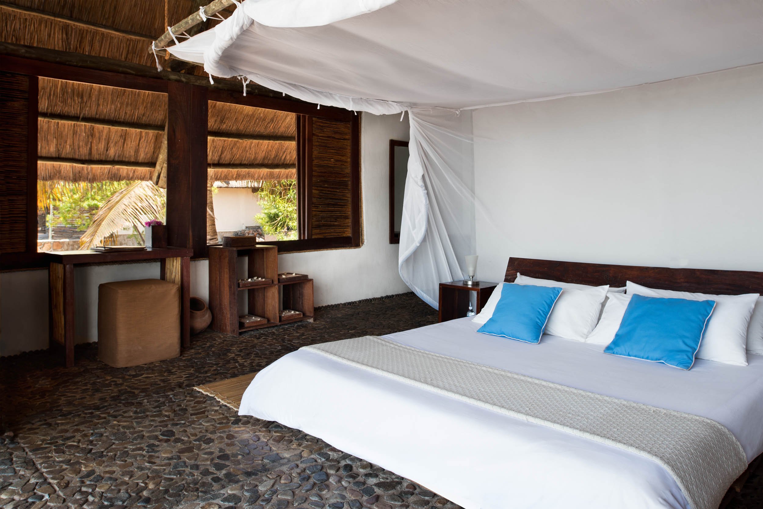 Lake Shore Lodge Tz - Lake Tanganyika - Honeymoon Suite bedroom.jpg