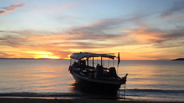 Lake Shore Lodge Tz - Lake Tanganyika - Activities - Sunset Cruise - Wanderer at sunset.jpg