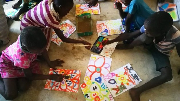 Lake Shore Lodge Tz - Lake Tanganyika - Giving Back - Centre of Learning - Children painting.jpg