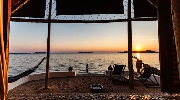 Lake Shore Lodge Tz - Lake Tanganyika - Swimming at sunset in front of the Chalet.jpg