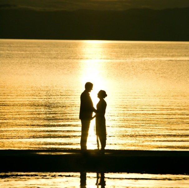 Lake Shore Lodge Tz - Lake Tanganyika - Bride and groom silhouette at sunset.jpg