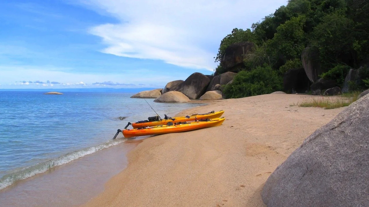 Lake Shore Lodge Kayaks on a beach.jpg