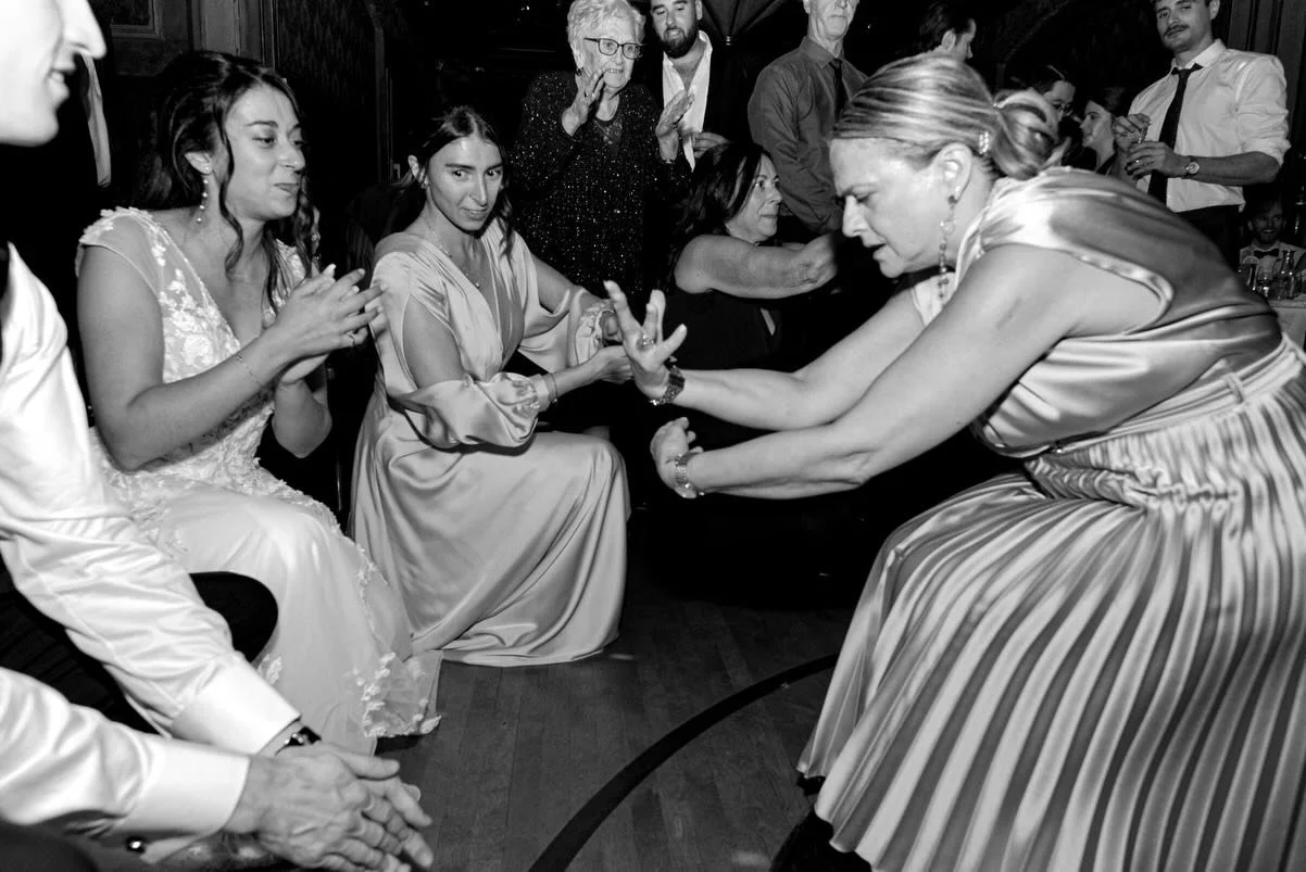 When one of you is half Greek, and quite unexpectedly, you and your new spouse are celebrated during your reception by your dear wedding guest in timeless Greek wedding fashion. These are the moments a documentary wedding photographer lives to captur