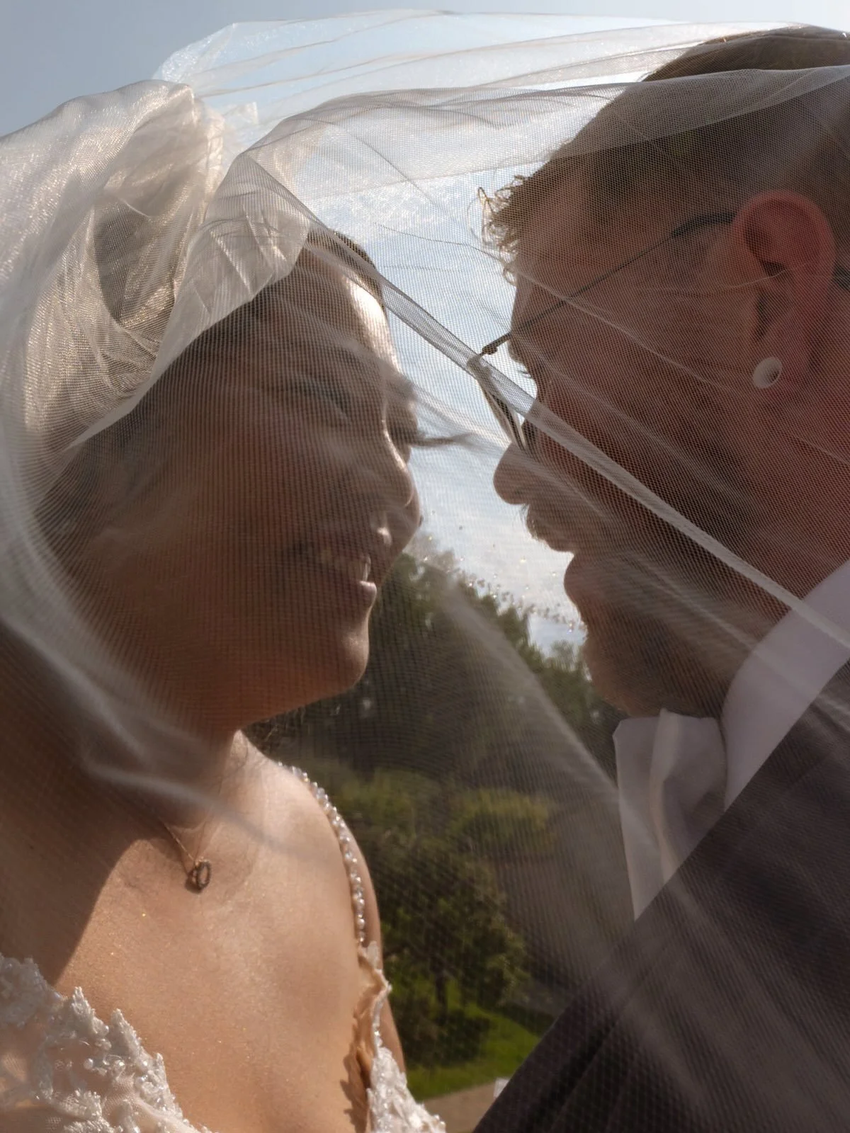 R&amp;C under the veil, following their first look and reading each other&rsquo;s vows. I love this frame equally in colour and in B&amp;W. The light, the wind, the depth of their connection, make it all so beautiful. 🥹

Haven&rsquo;t done this in f