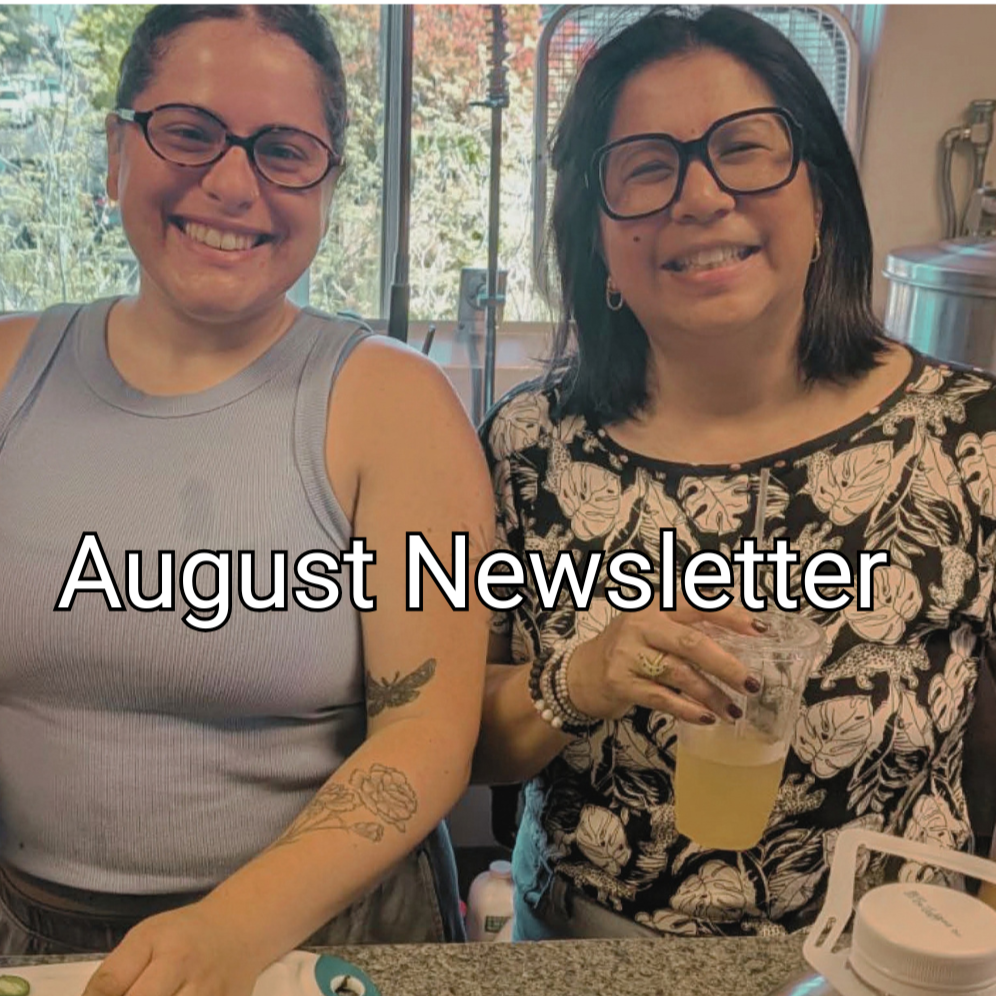 "August Newsletter" is written over a picture of two people smiling in a kitchen while preparing a meal together.