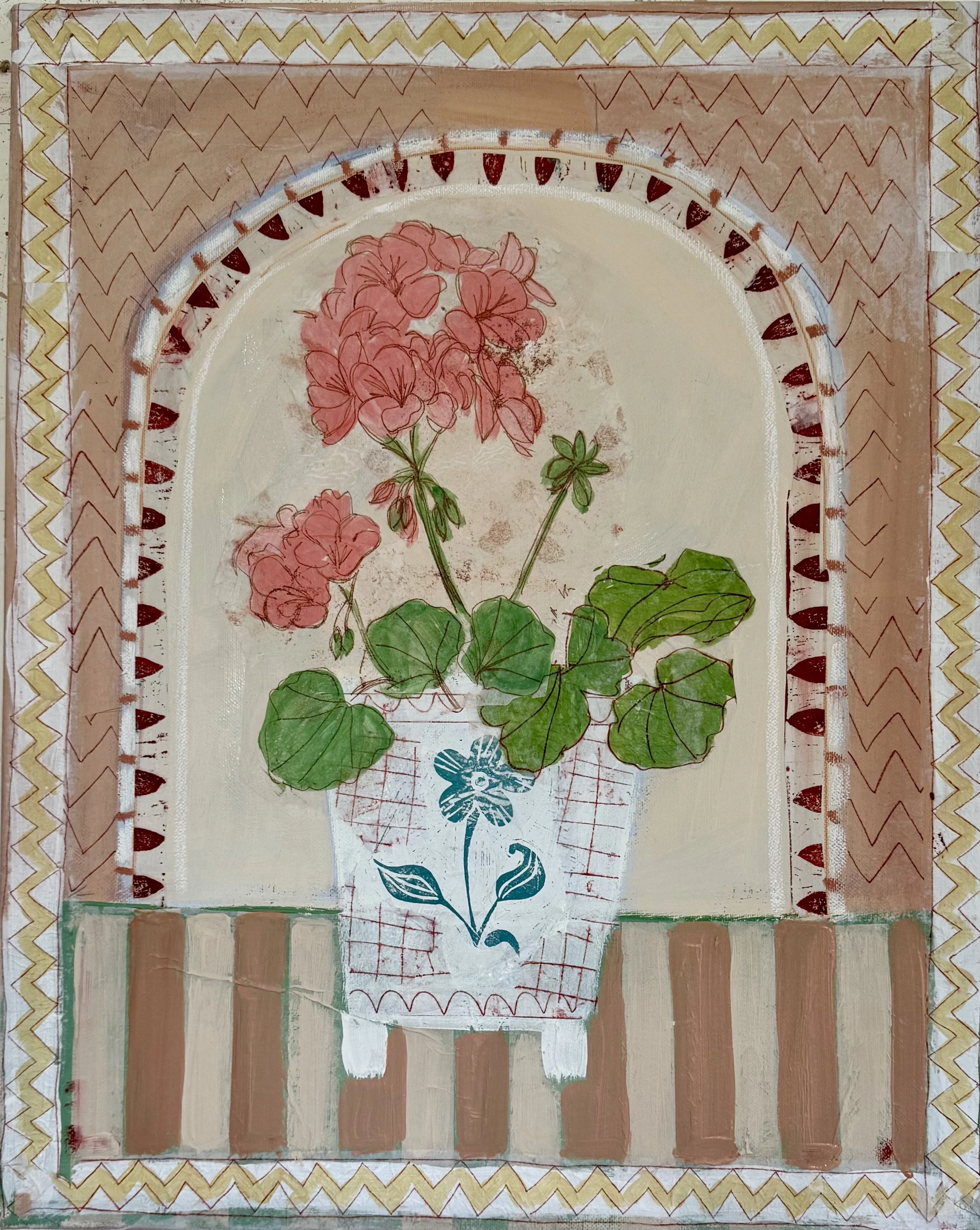Close-up of three sheets of colorful, decorative paper with floral and geometric designs, layered on a wooden surface.