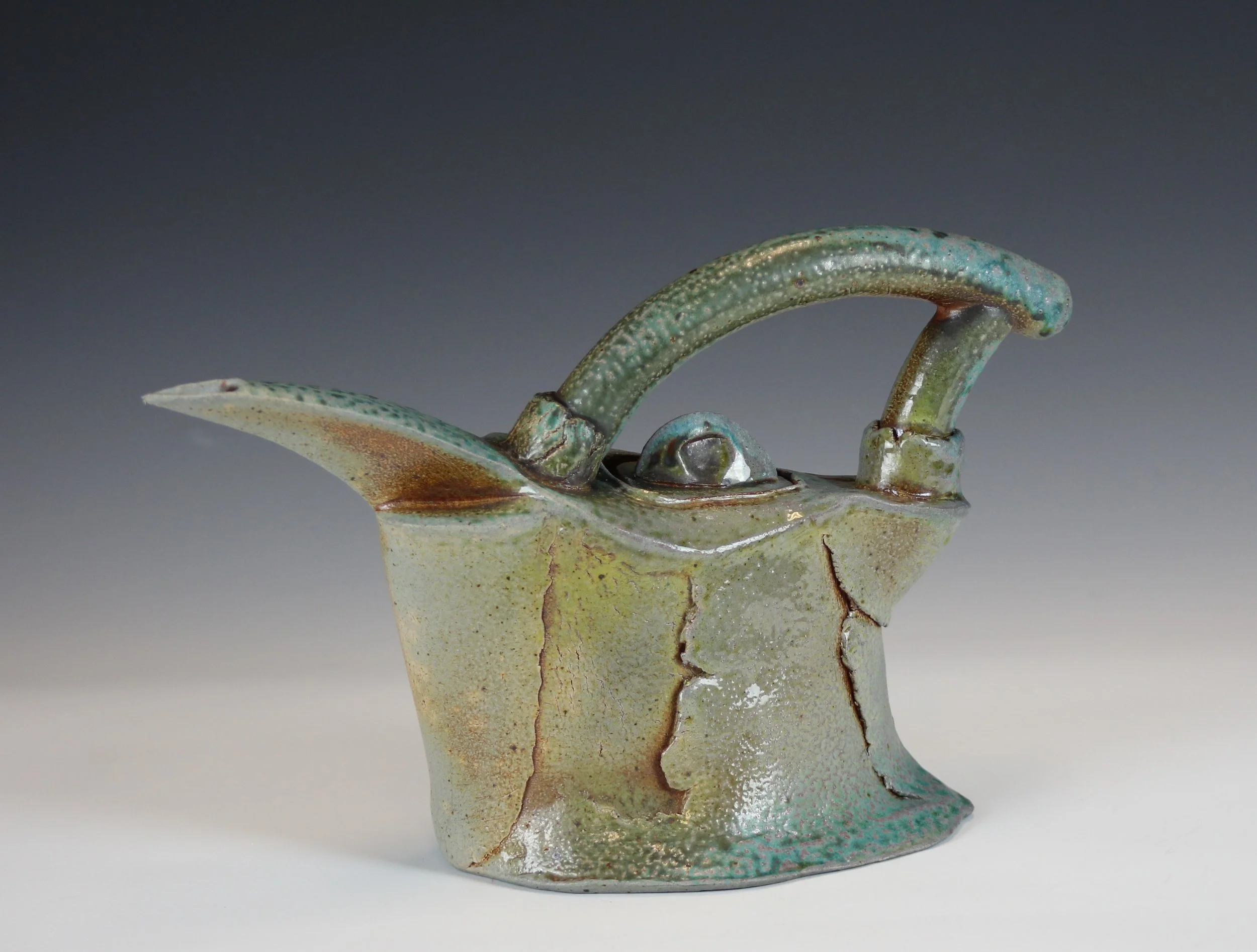  Soda fired Stoneware fired in reduction to cone 10. Hand built with overlapping and wrapped slabs with some pinching, 9”h X 14”l X 4”w.  Accepted to the “74 Annual May Show”, Mansfield Art Center, Mansfield, Ohio, May 4 - June 2, 2019.  Accepted Lim