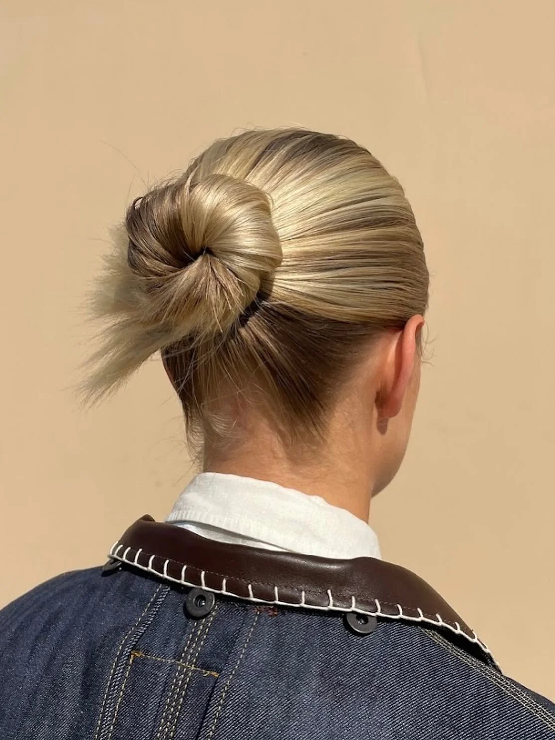 Slicked back with a spikey bun 💛