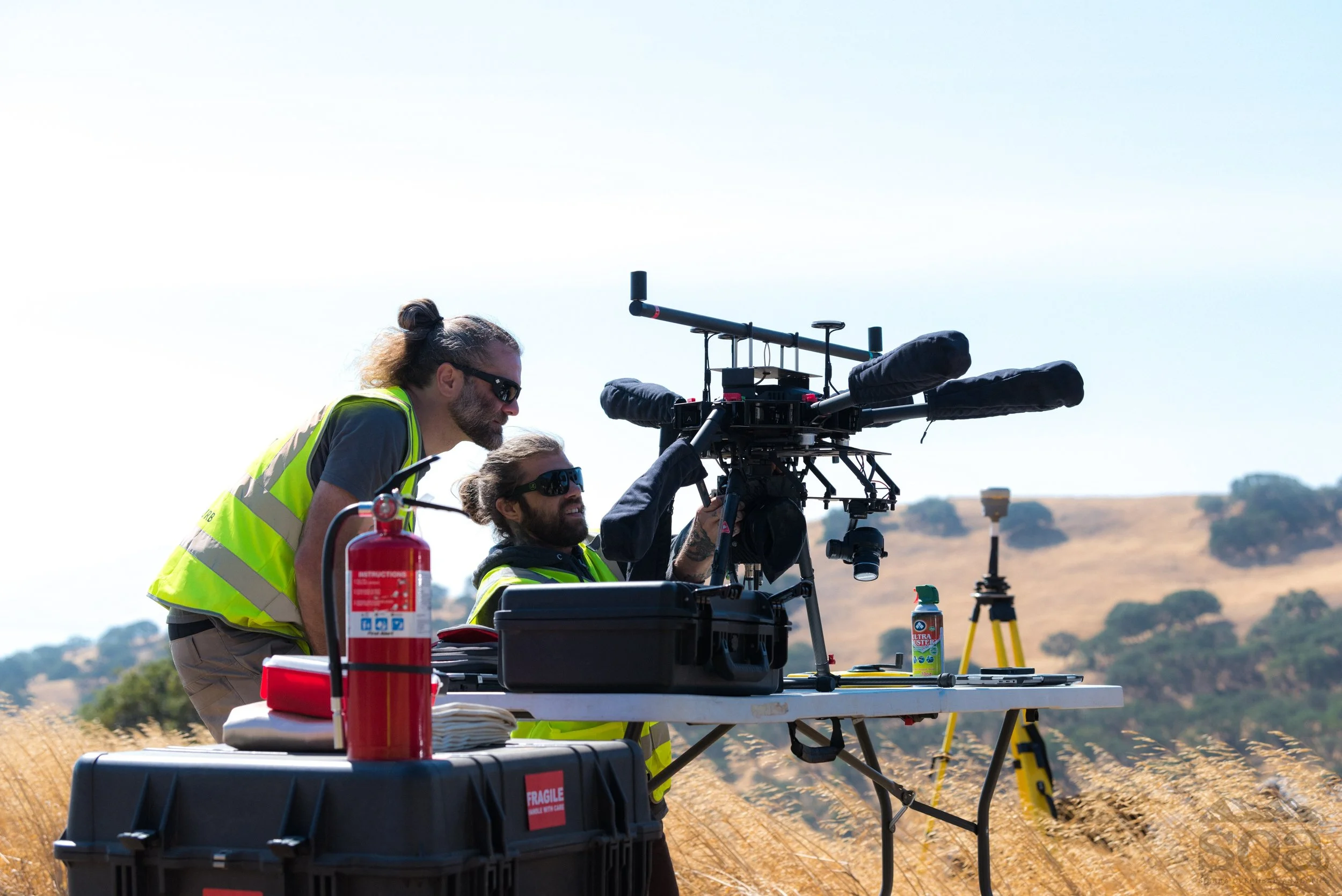 SOA field crews preparing a LiDAR-equipped sUAS for flight in Tulare, CA.