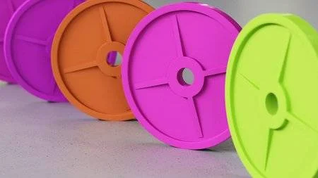 86946170-neat-line-of-variously-oriented-weight-plates-on-a-modern-minimalistic-neutral-surface-this-image-is.jpg