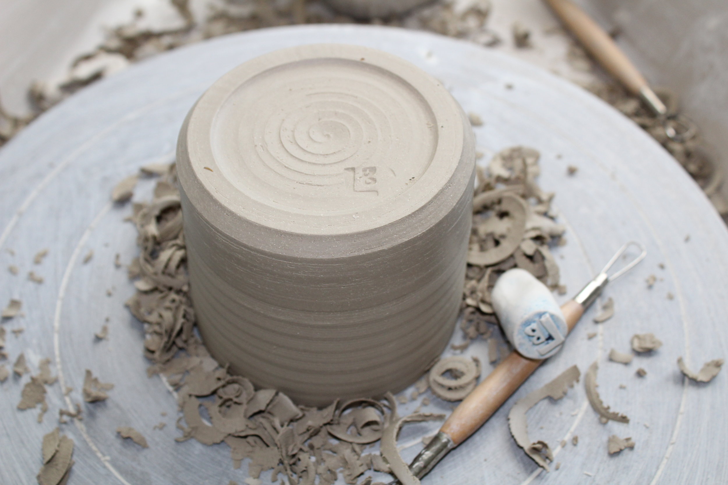 Turning the base of a pot.