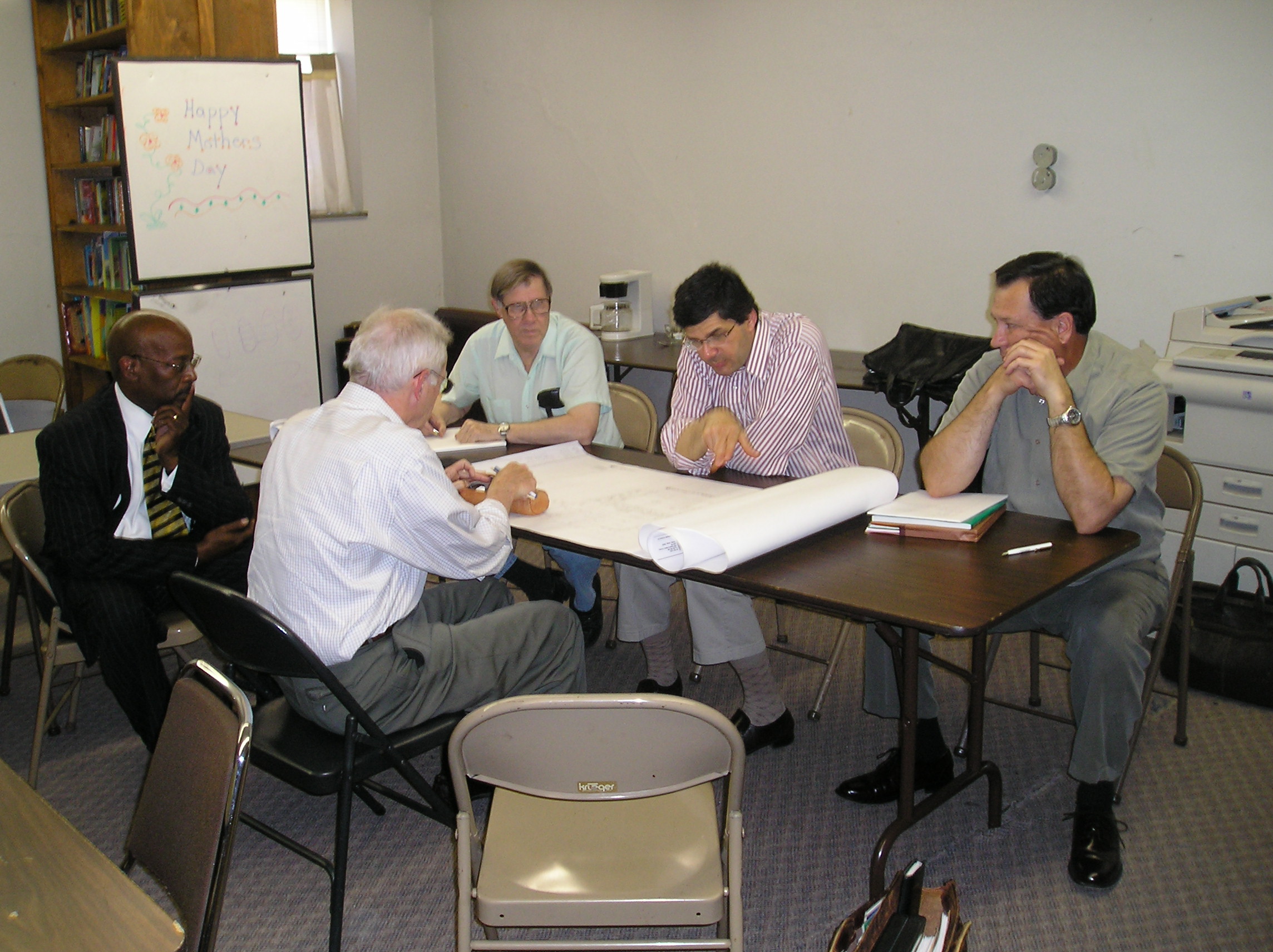 FOSS  members reviewing blueprints